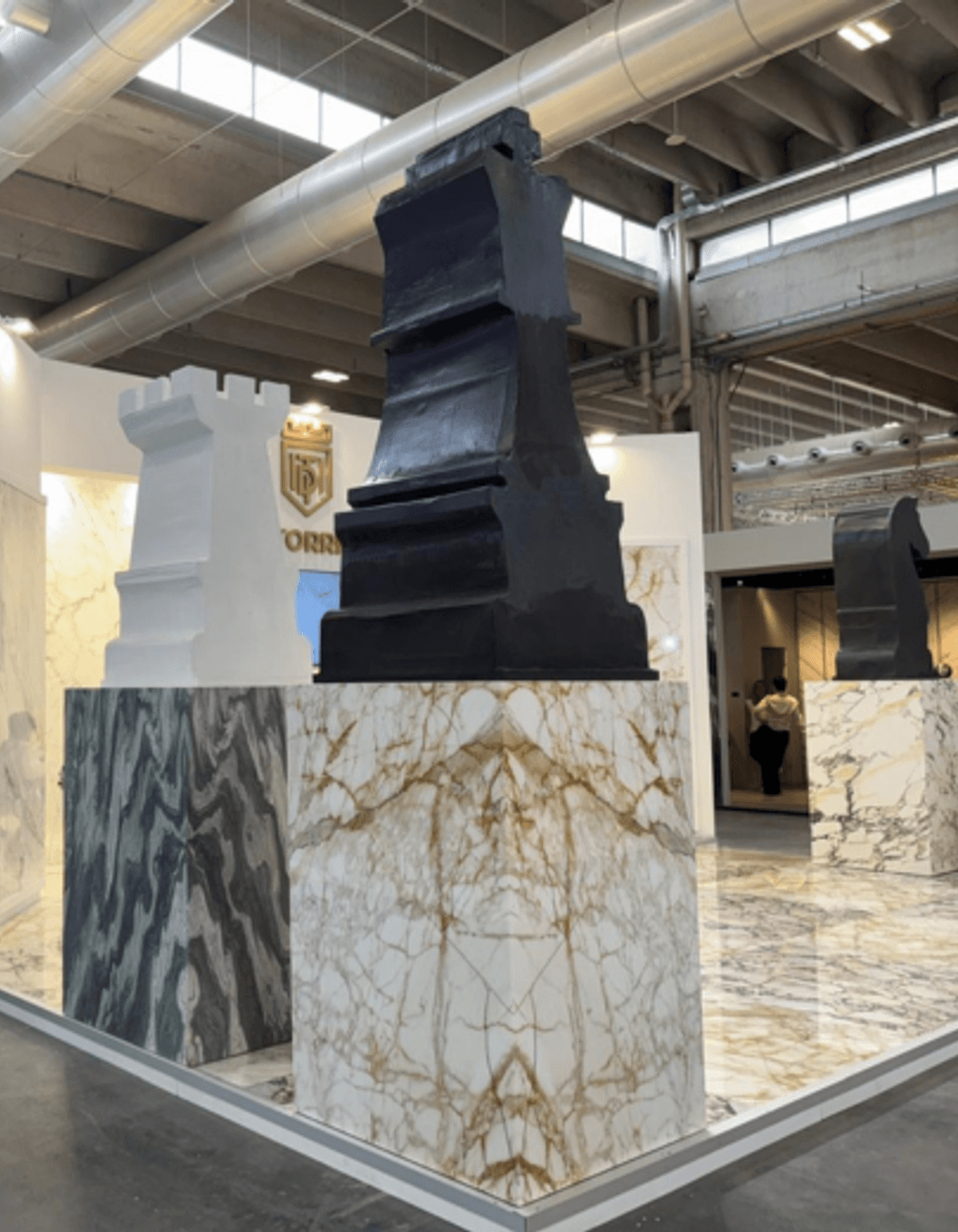 Bold statements in marble. This Marmomac booth highlights the drama of large-format slabs and book-matched panels, from striking grey veining to warm tobacco tones. It's about showing stone at scale, the way it will actually live in a project.