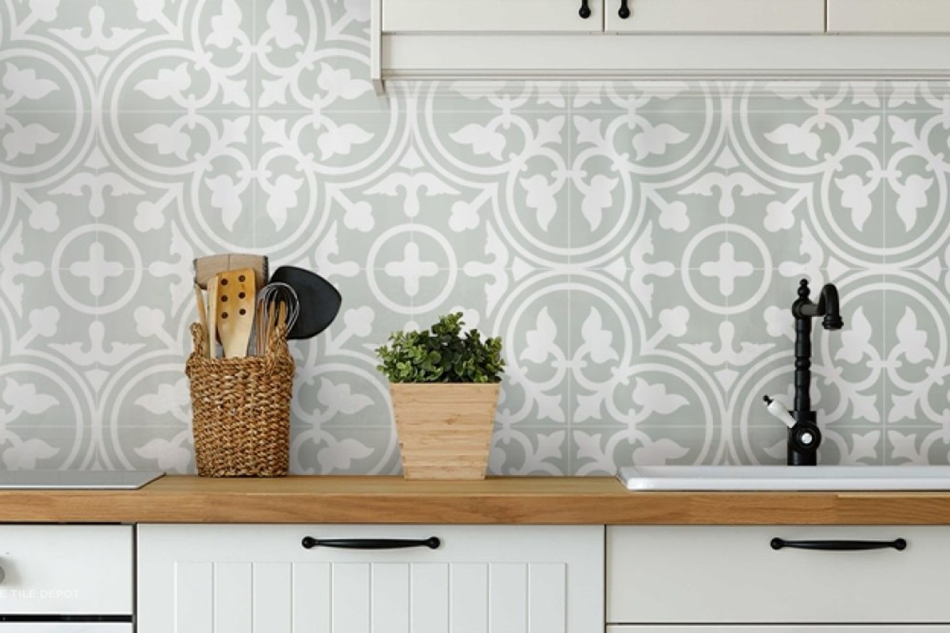 Artisan patterned tiles from Tile depot were used as a splashback. The neutral and light colours used are versatile and can be used for most kitchen designs. The patterns on the tile give the kitchen an artistic look and elevates the overall design of the