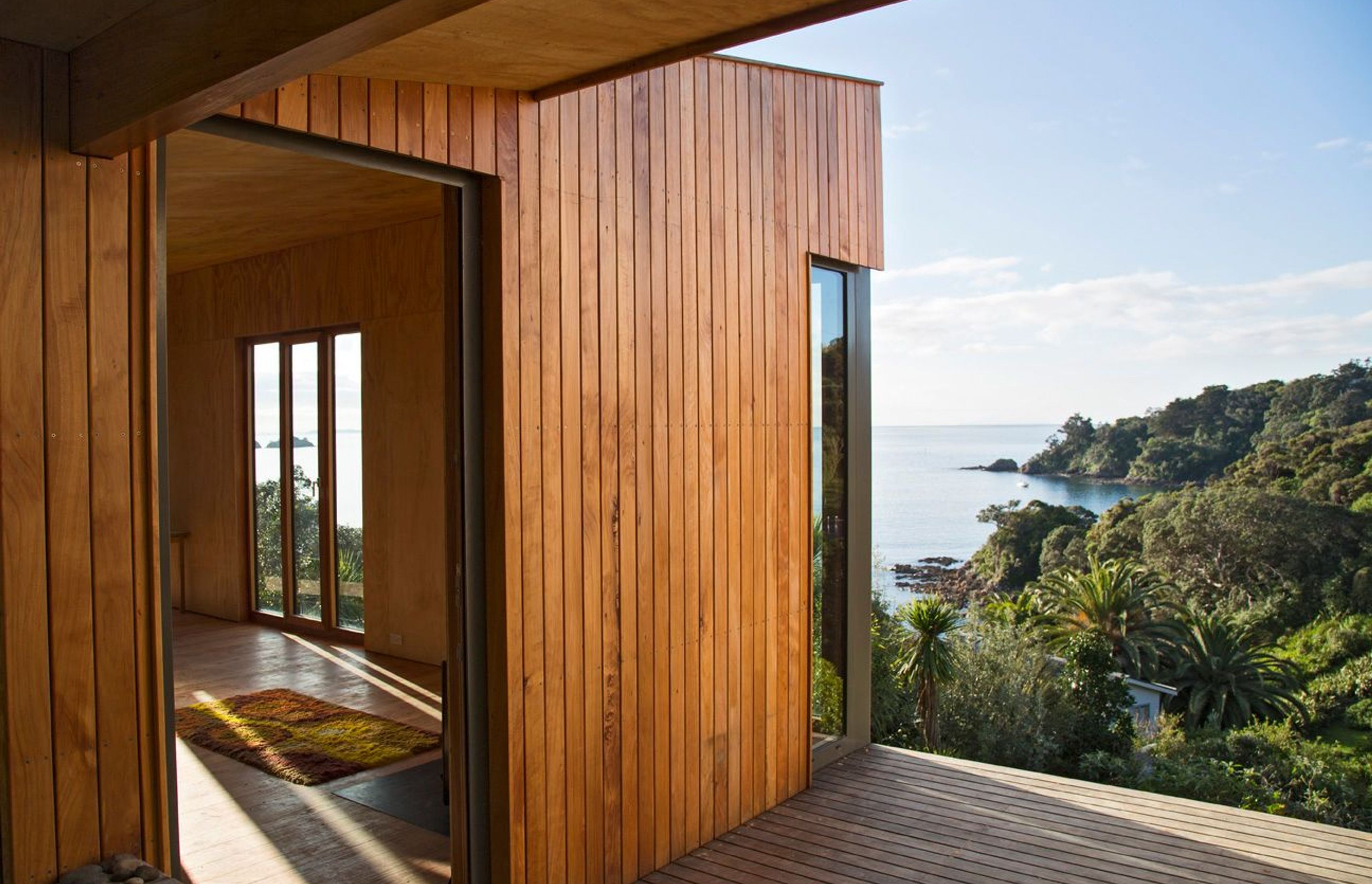 Located at Hekerua Bay on Waiheke Island, Cora House by Bonnifait + Giesen is orientated to take in the ocean view, while protecting the interior from cold and wind during winter and excessive sunlight during summer. Photograph by Russell Kle