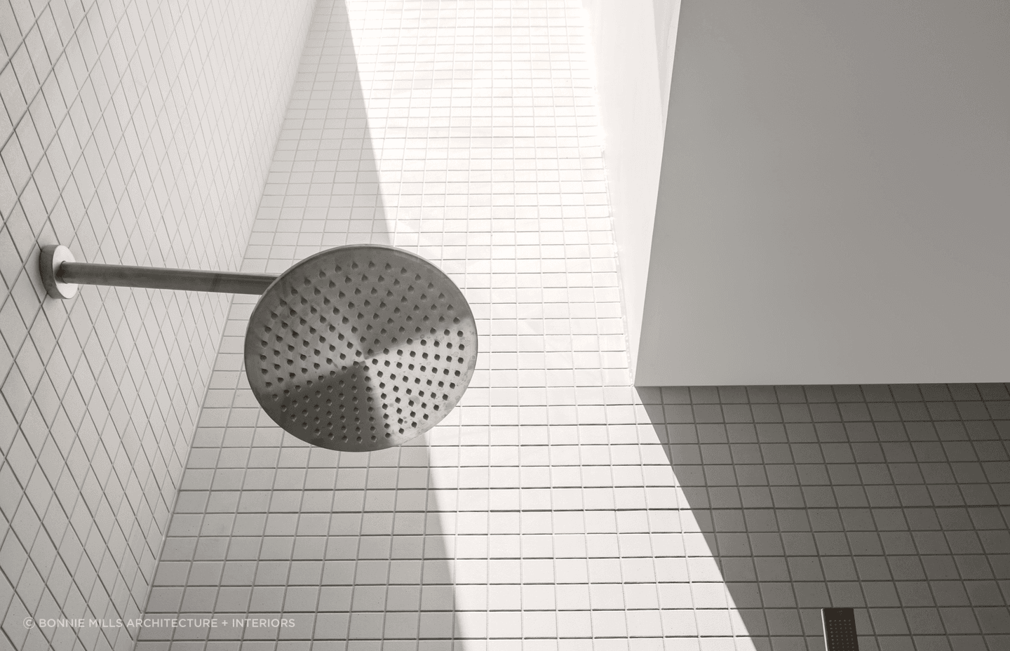 Rain shower heads disperse water evenly to simulate the feeling of rainfall for a soothing experience. Featured project: Brighton East Residence