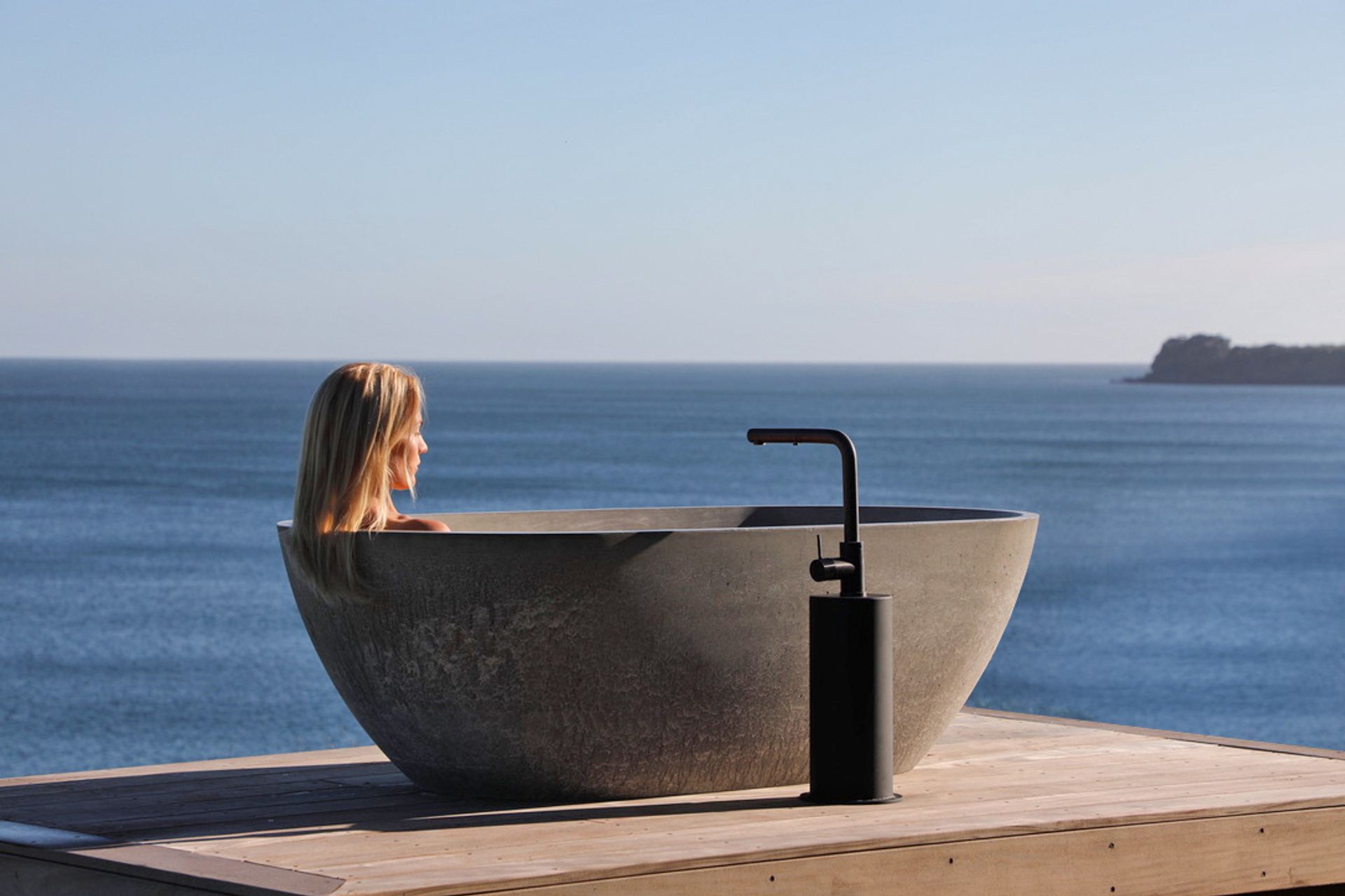 Bridget enjoying the outdoor bath overlooking the view.