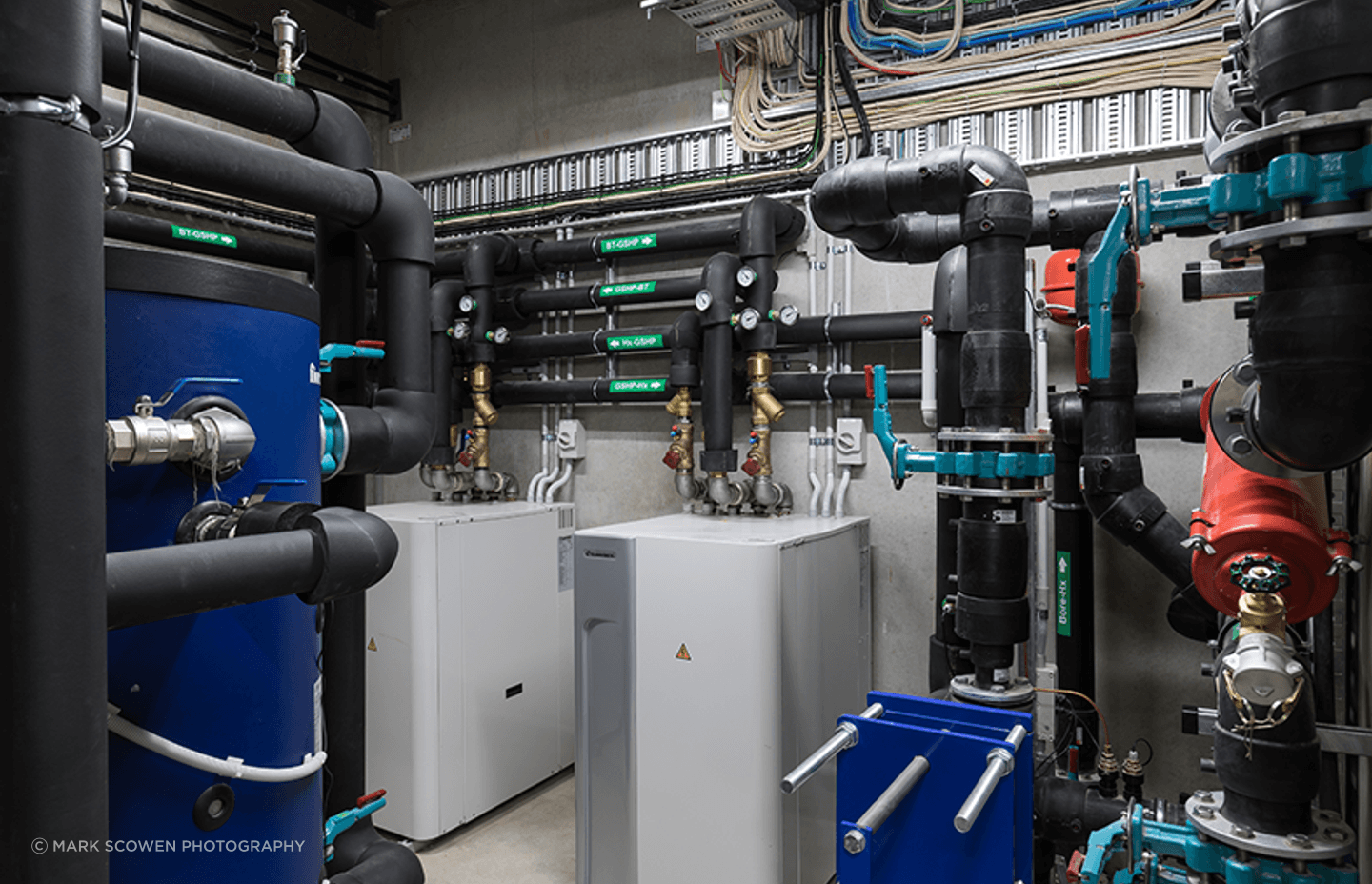 Cosgroves designed and installed a mechanical and hydraulic solution for Blum that includes a perimeter trench heating system fed via an open loop ground-source heat pump system, as well as a natural ventilation system controlled by an automated weather s
