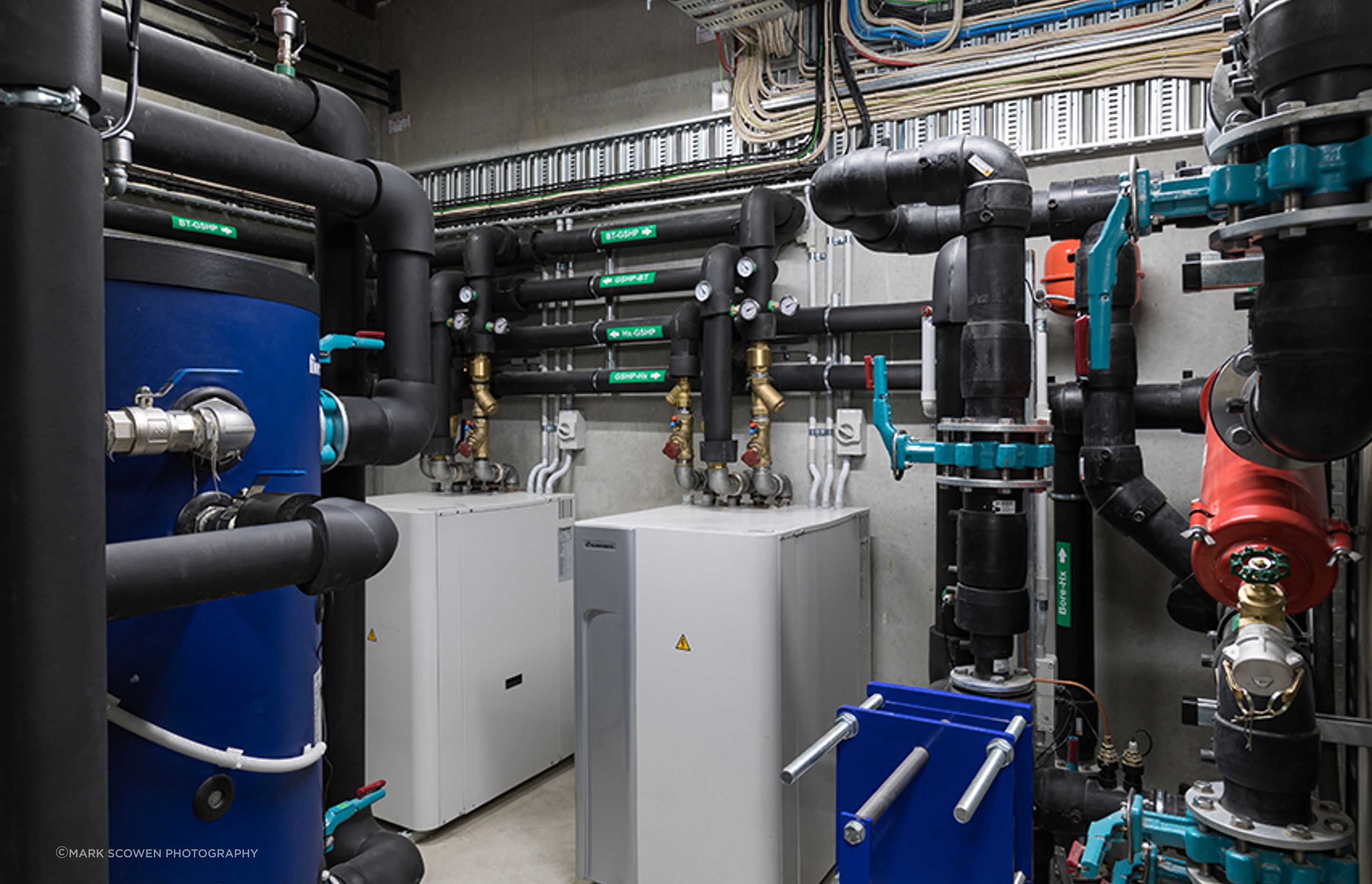 Cosgroves designed and installed a mechanical and hydraulic solution for Blum that includes a perimeter trench heating system fed via an open loop ground-source heat pump system, as well as a natural ventilation system controlled by an automated weather s