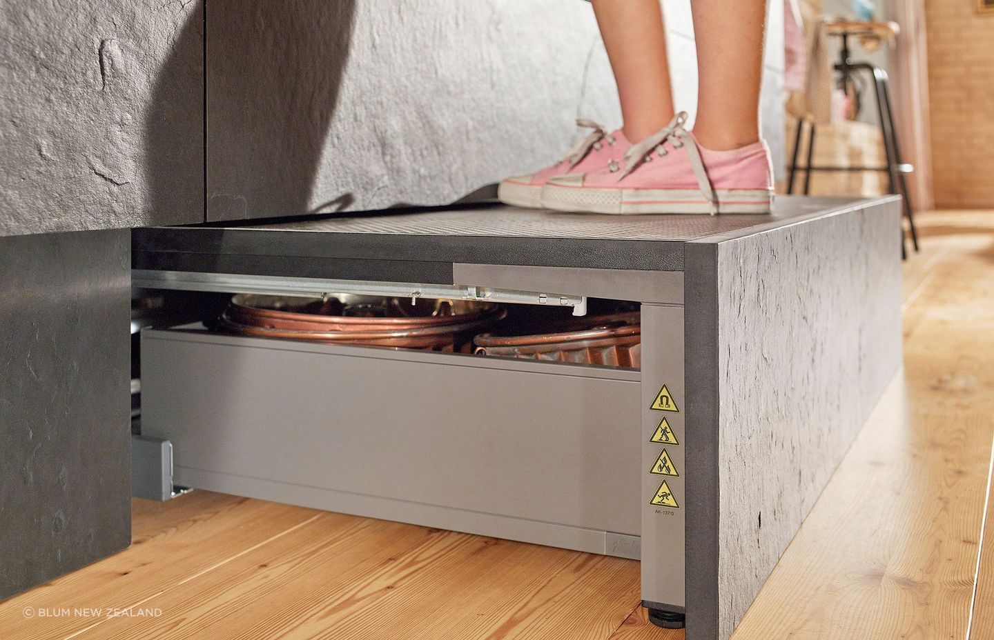 An easily accessible area for additional storage, the Space Step sits concealed behind the toe kick.