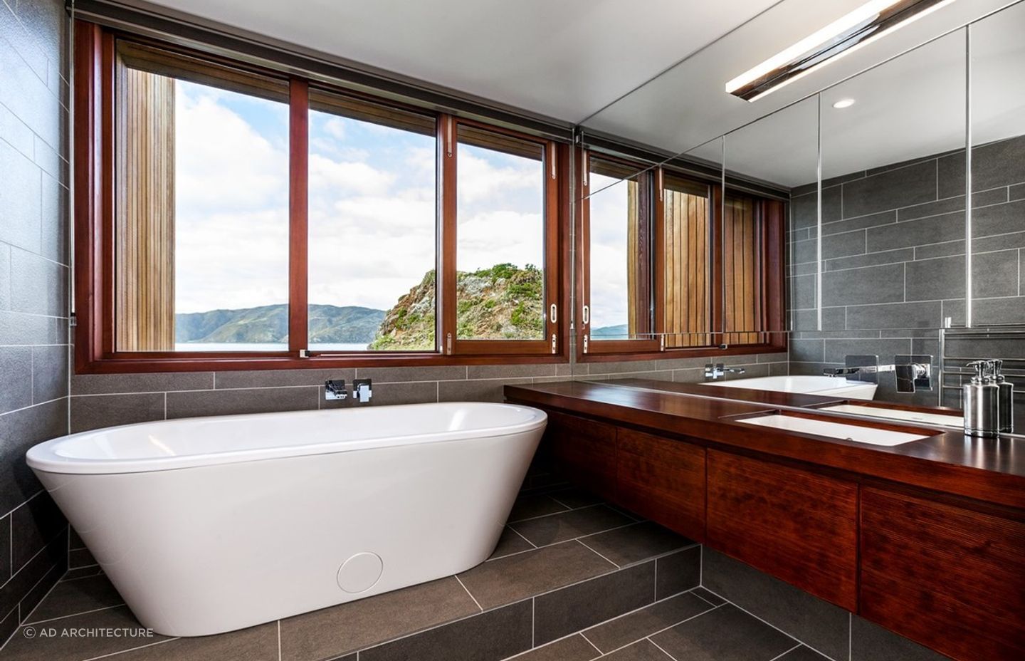 A freestanding bathtub with an exquisite view of natural landscape and surroundings