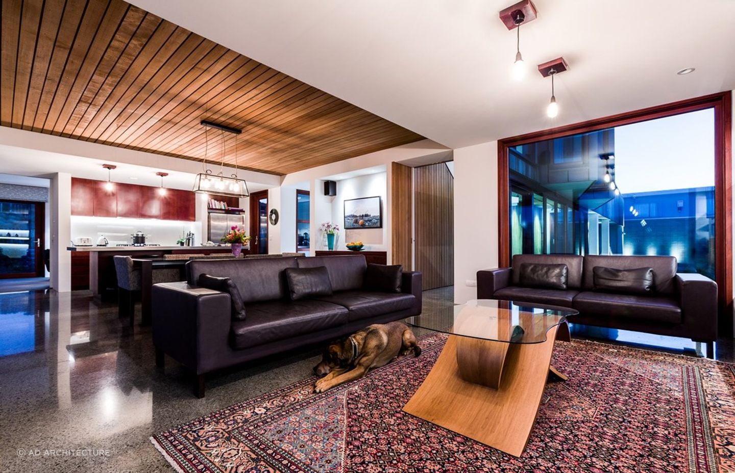 The exterior aesthetic is cohesively continued through the Seatoun home's interiors