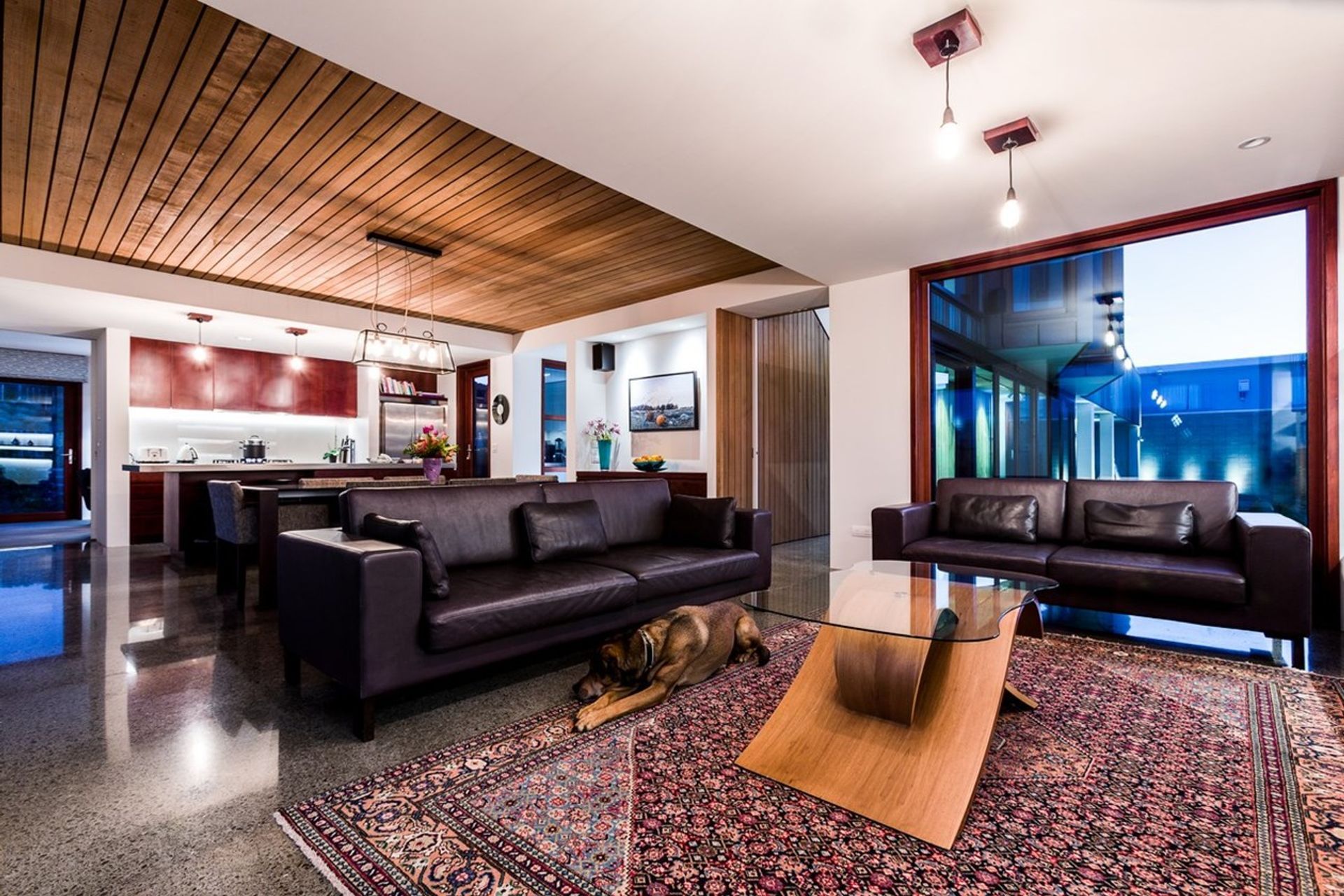 The exterior aesthetic is cohesively continued through the Seatoun home's interiors