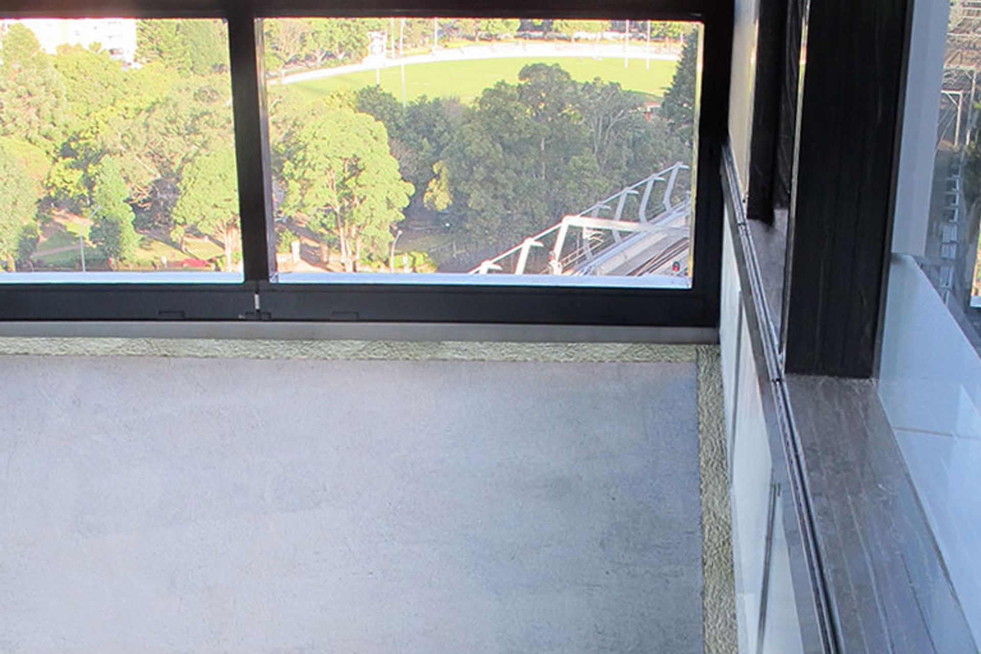 Curtain wall batts installed at slab edge