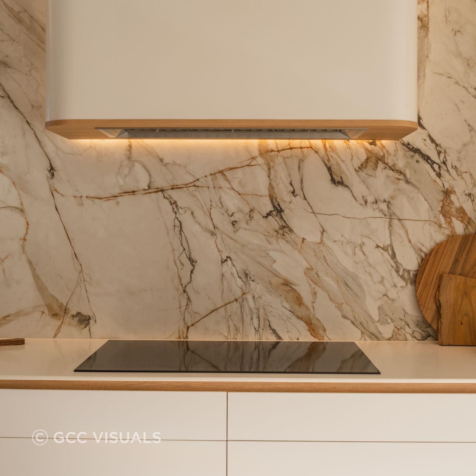 The Avenue. Dramatic Neolith stone is a feautre of this coastal inspired kitchen. Signature CBGH curved rangehood joinery detail.
