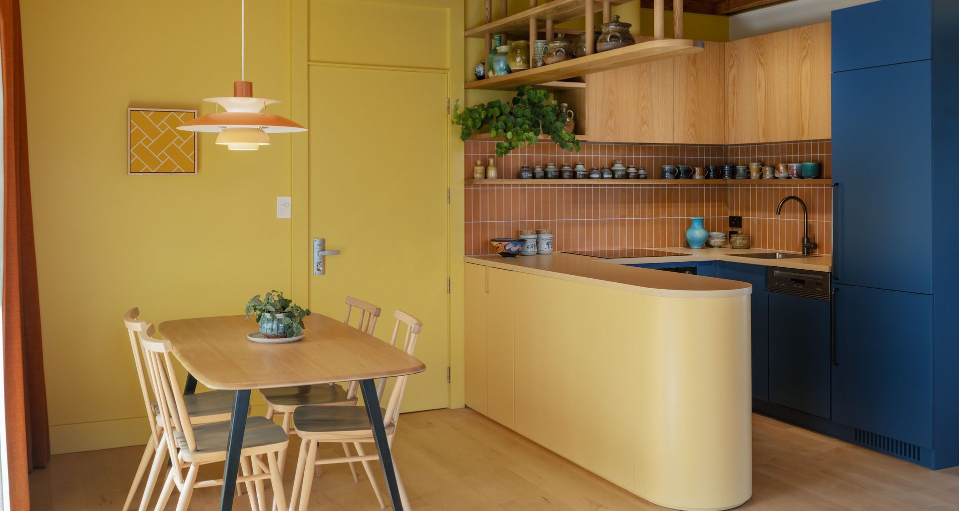 Interior Design and Architecture by Chris Corson-Scott and Pac Studio – All Purpose Chair and Plank Table by Lucian Ercolani for L. Ercolani. Pottery on the overhead shelf by Andrew Van Der Patten