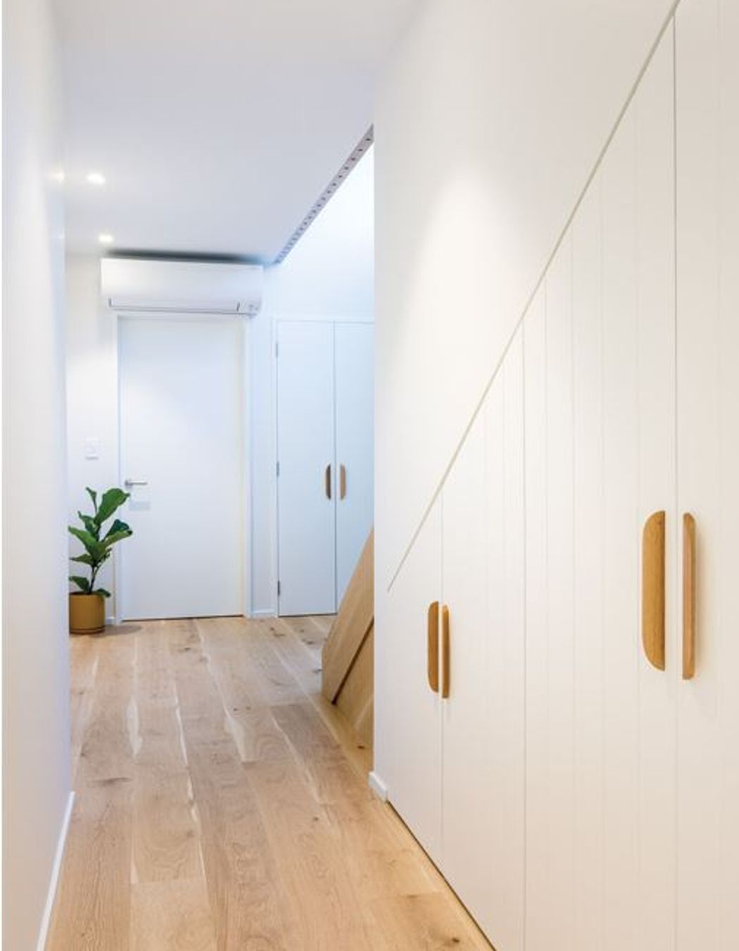 NATURAL WARMTH Engineered wooden flooring in the living areas and woollen Bremworth carpets in the bedrooms are from The Flooring Centre.