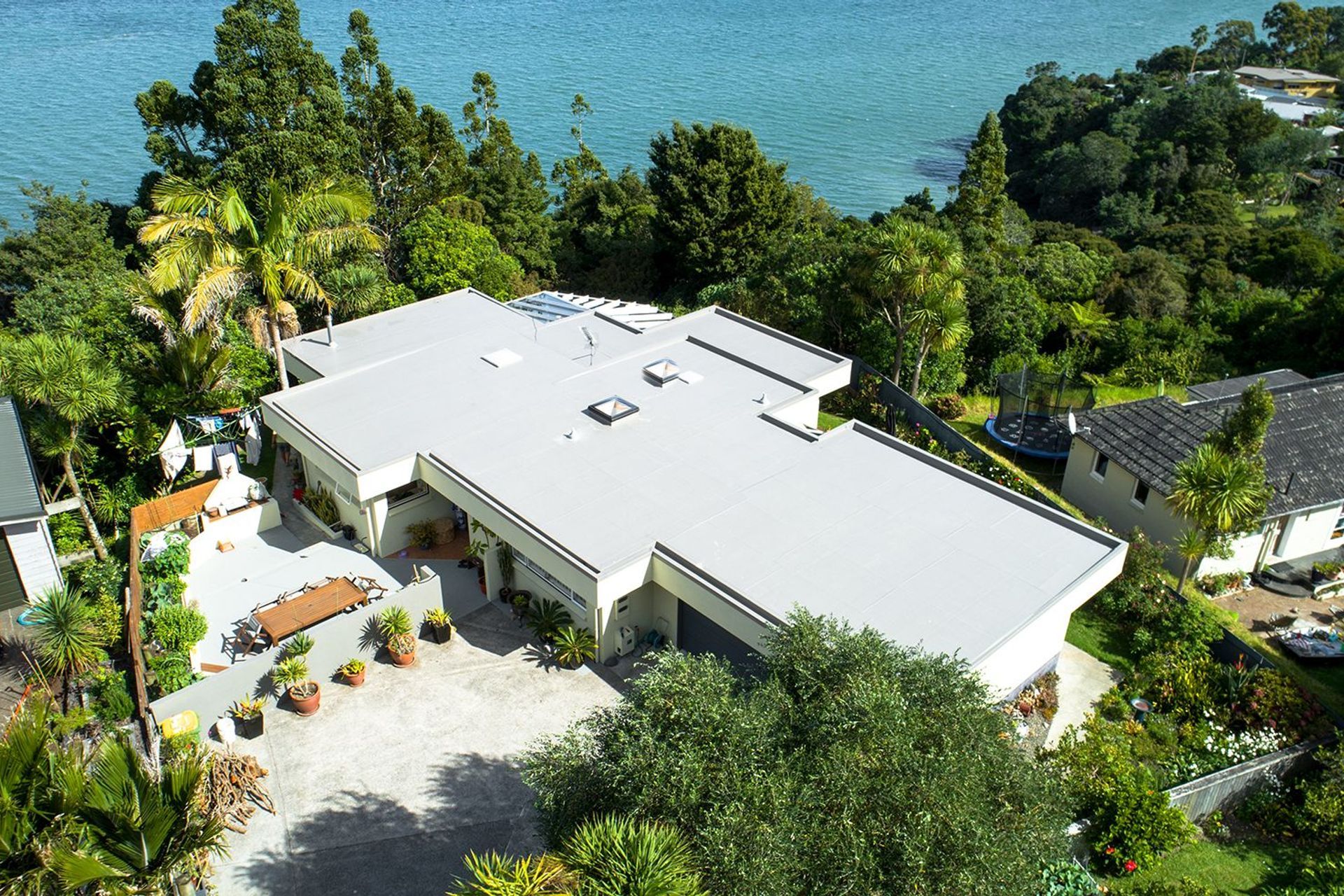 Lighter coloured roofs, such as this one, are termed 'cool roofs' for their ability to help mitigate energy costs and reduce the heat island effect felt in suburbs and cities.