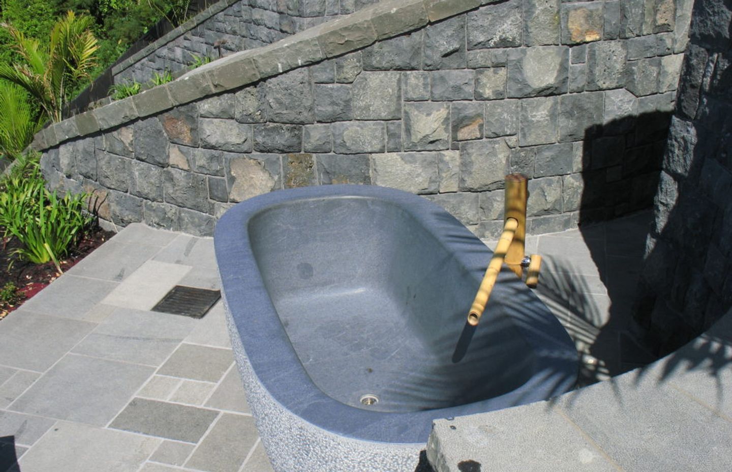 The exterior of bath is bush-hammered. The interior and top edge is honed.