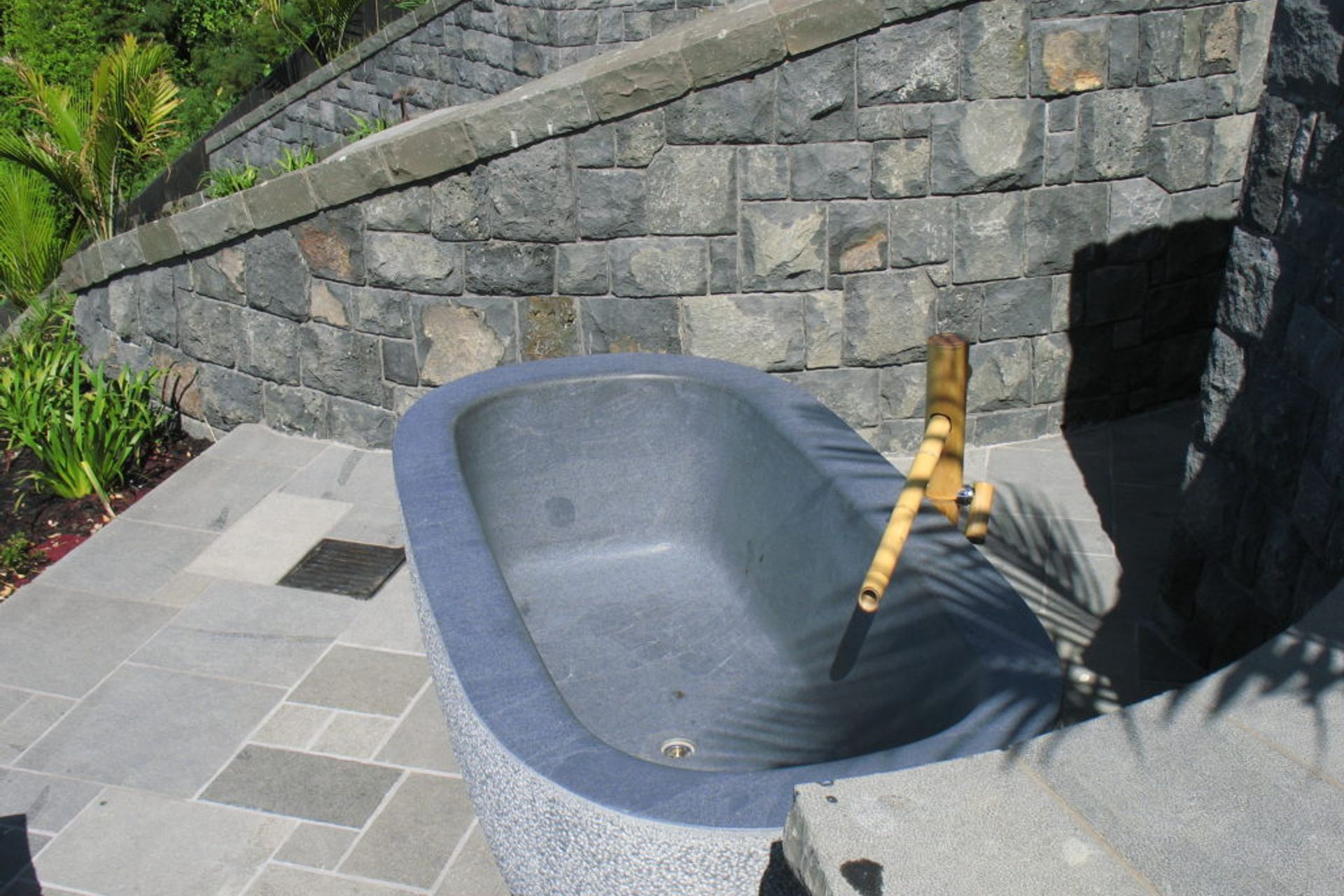 The exterior of bath is bush-hammered. The interior and top edge is honed.