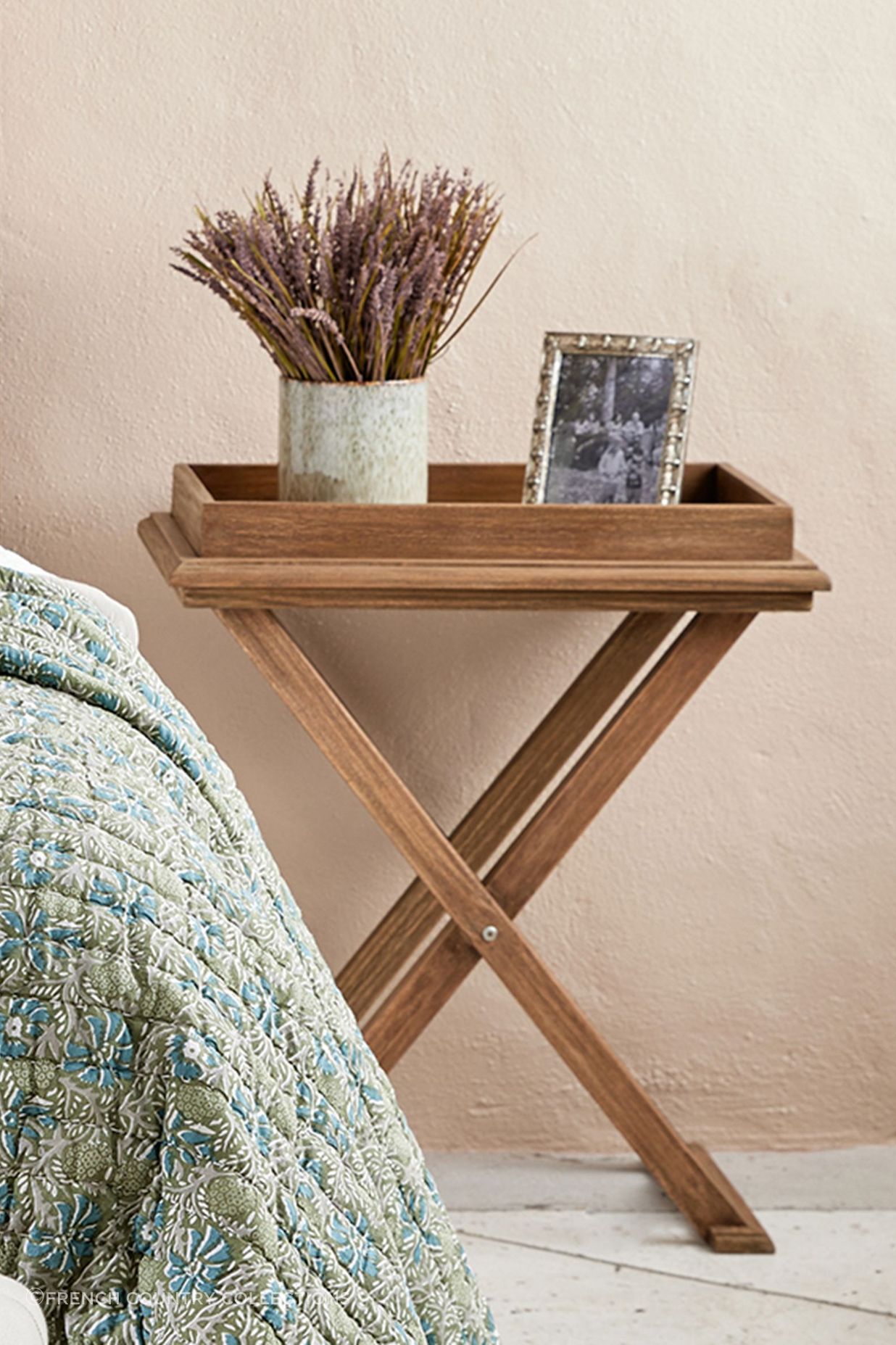 Exuding rustic charm and earthy tones, the cross leg tray table stands as a unique blend of functionality and style.