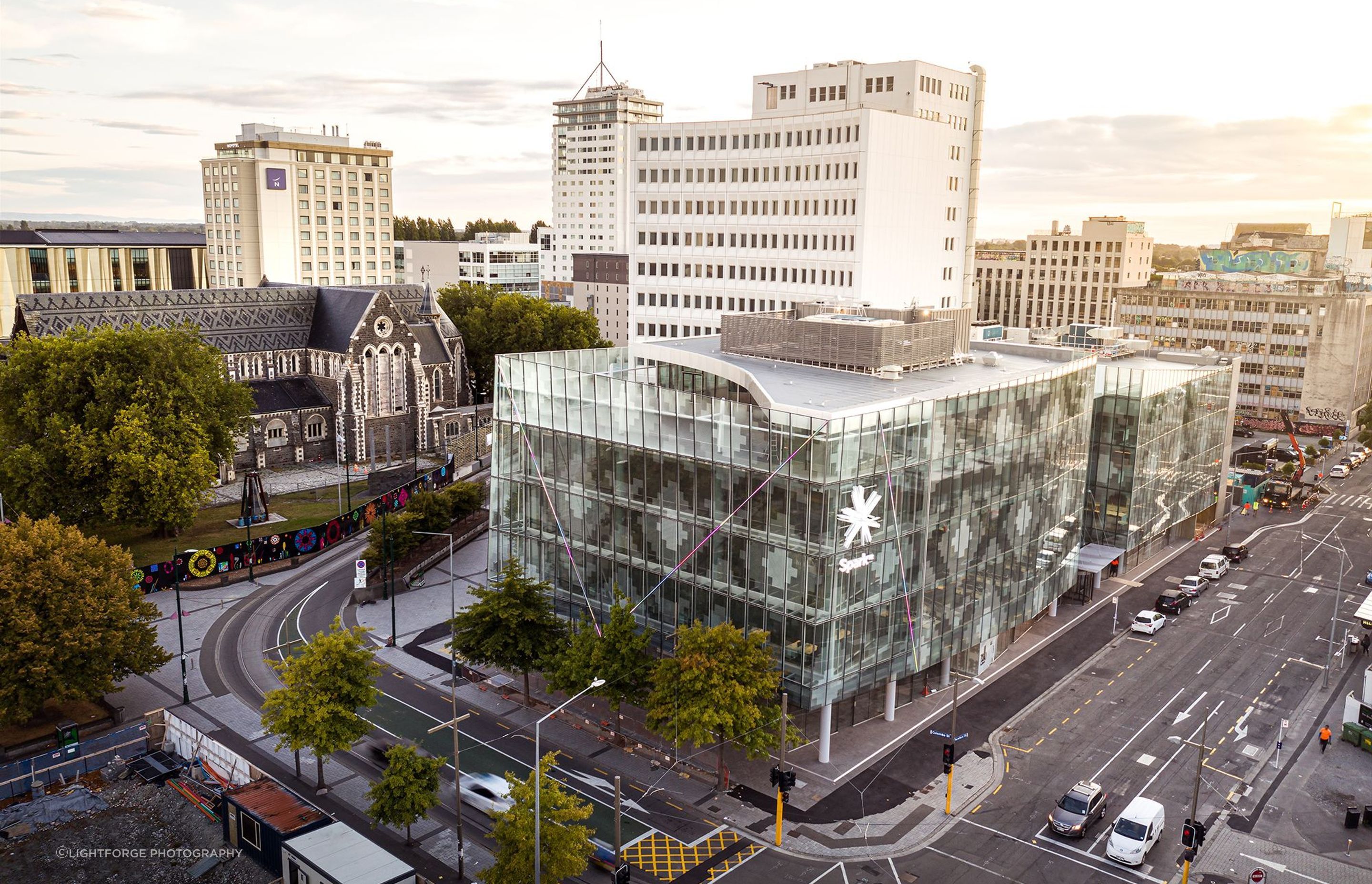 A contextual view of 2 Cathedral Square, showing the patterned glazed facade in relation to the patterned slate roof of ChristChurch Cathedral. Photograph: Dennis Radermacher/Lightforge.