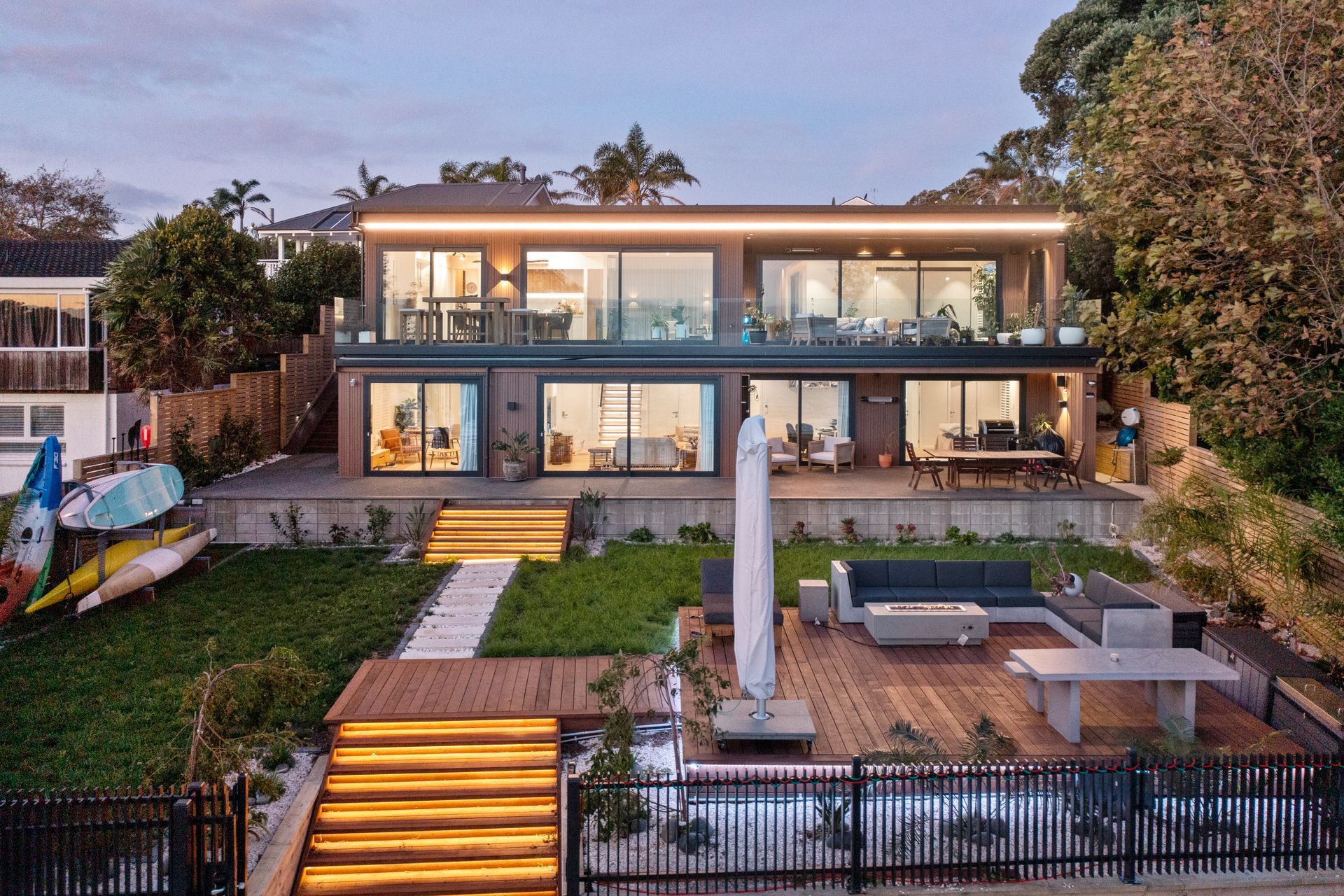 Recessed strip lighting was installed on the steps and around the deck to illuminate the entertainment area.