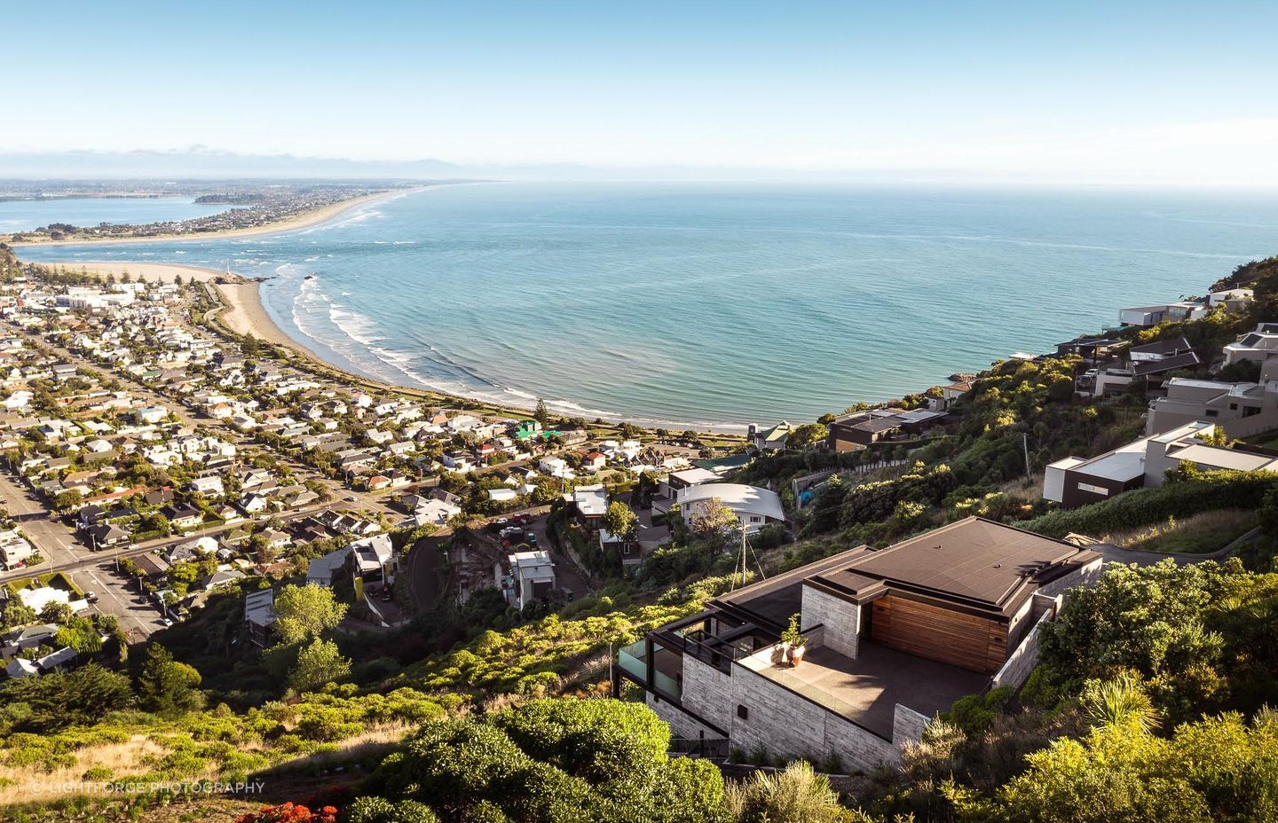 The home is built on the edge of a dormant volcano, on a site that has a 30 degree slope.