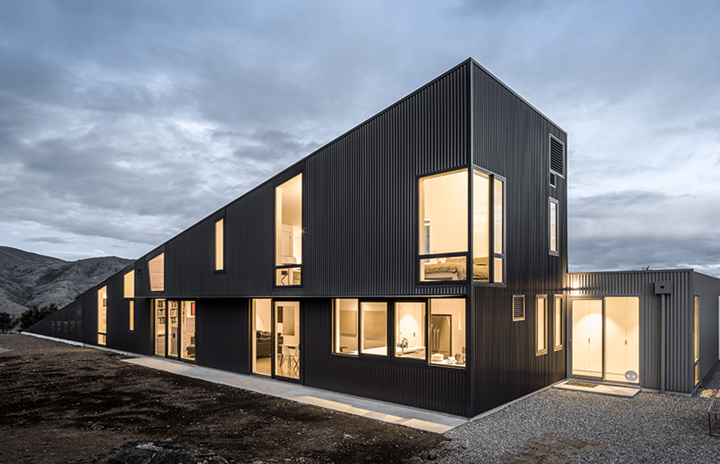 Dimond Roofing Corrugate in Black and Grey Friars was specified for this Wanaka house. Installed by RoofingSmiths.