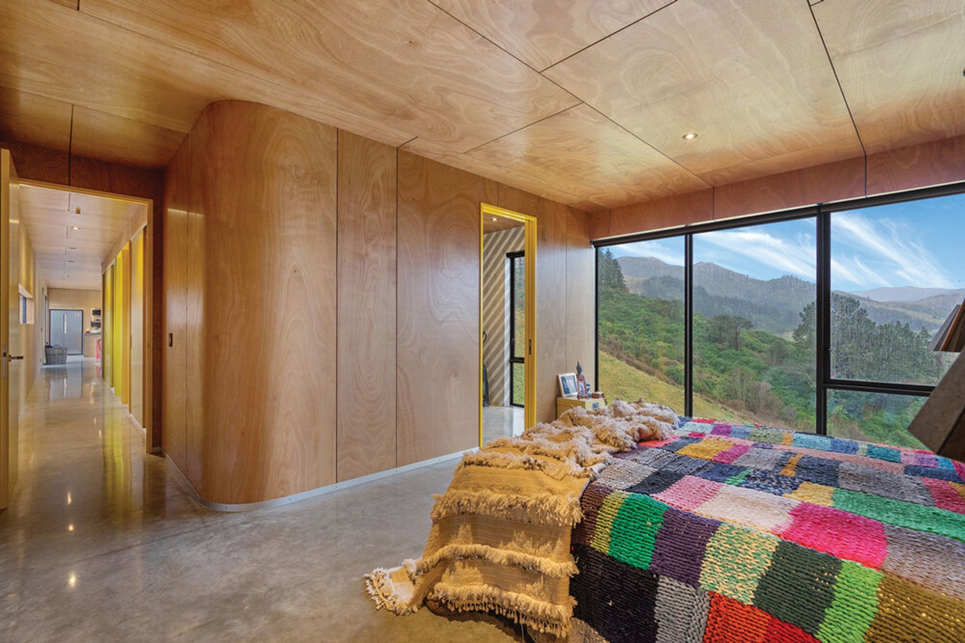 The plywood interior cladding represents the flower's woody pod and the white American oak joinery complements the okume plywood beautifully.