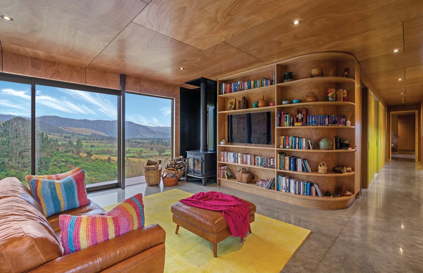 The 10-metre wide windows draw in the winter sun, trapping the warmth in the concrete floor and allowing the owners to walk barefoot in June and July.