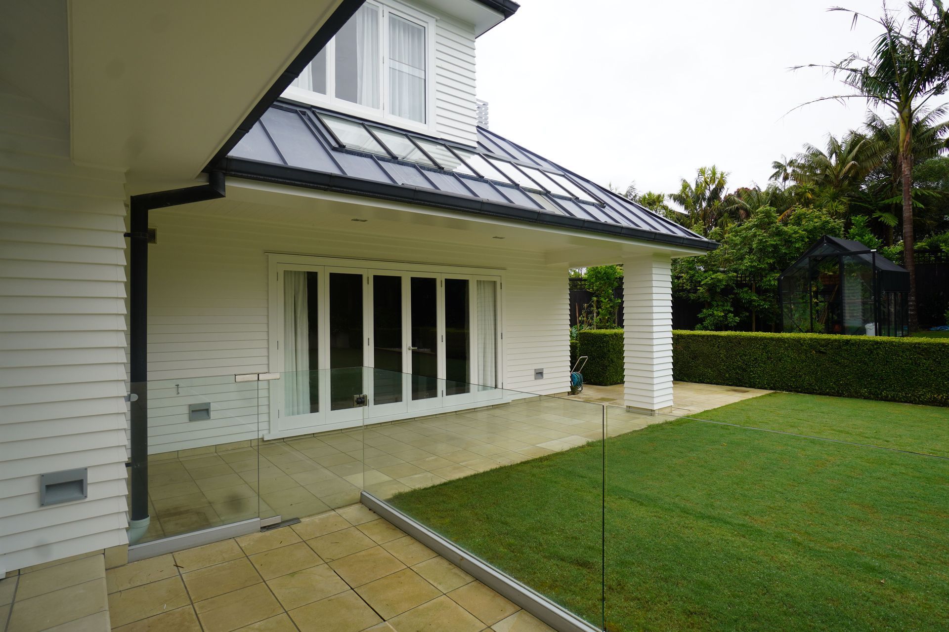 This outdoor living space in the landscape will be renovated to change the layout, as well as the floors.