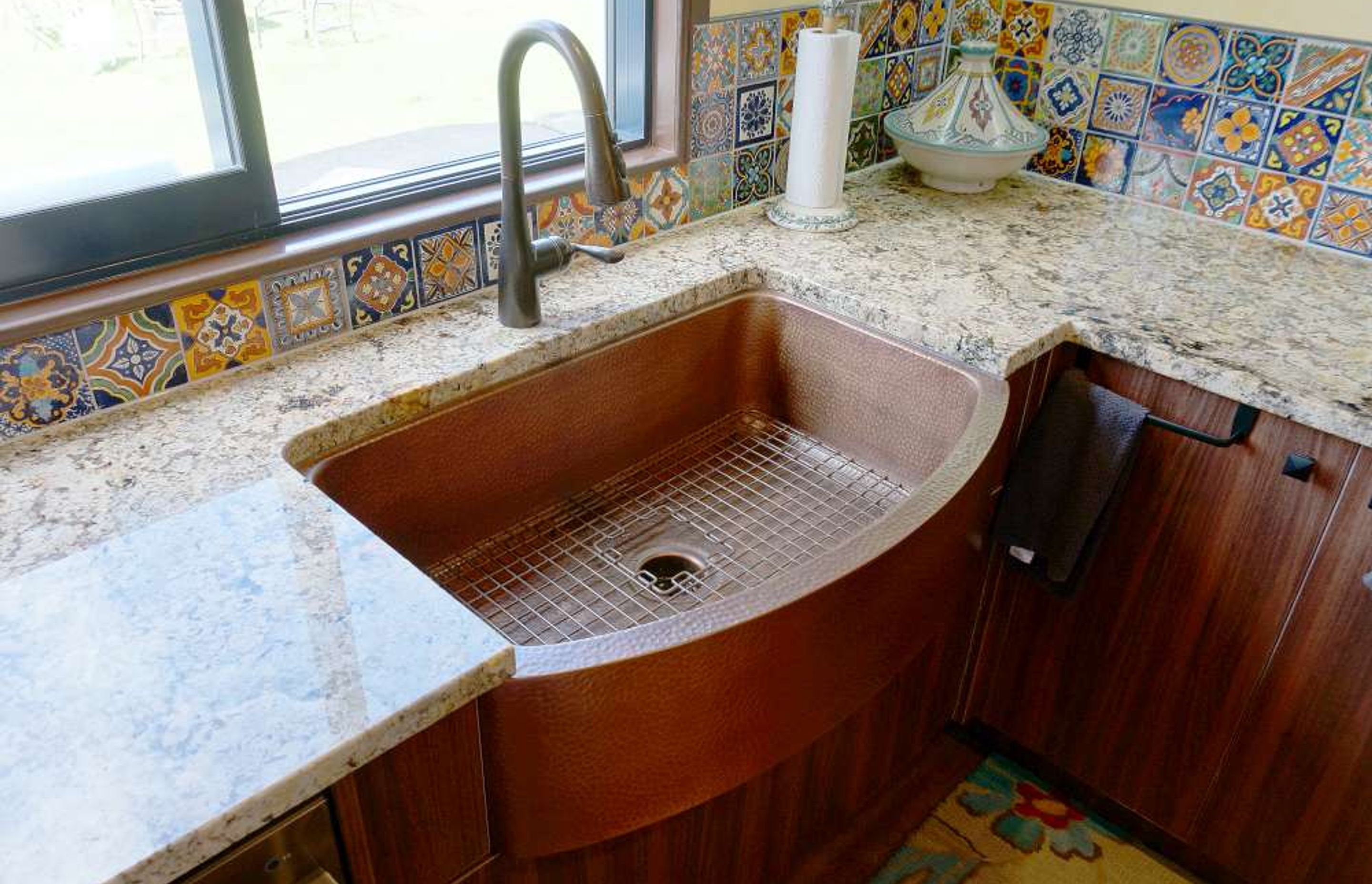 Brass sink and dull brass tap used to make the kitchen look rustic yet traditional