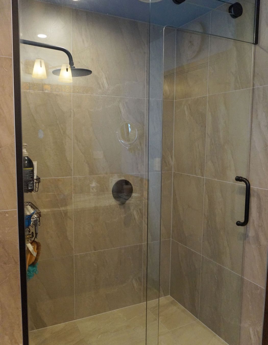This tiled shower was renovated with a floor to ceiling glass door to make the bathroom look more open and spacious – Bathroom renovation in Stanmore Bay, Auckland
