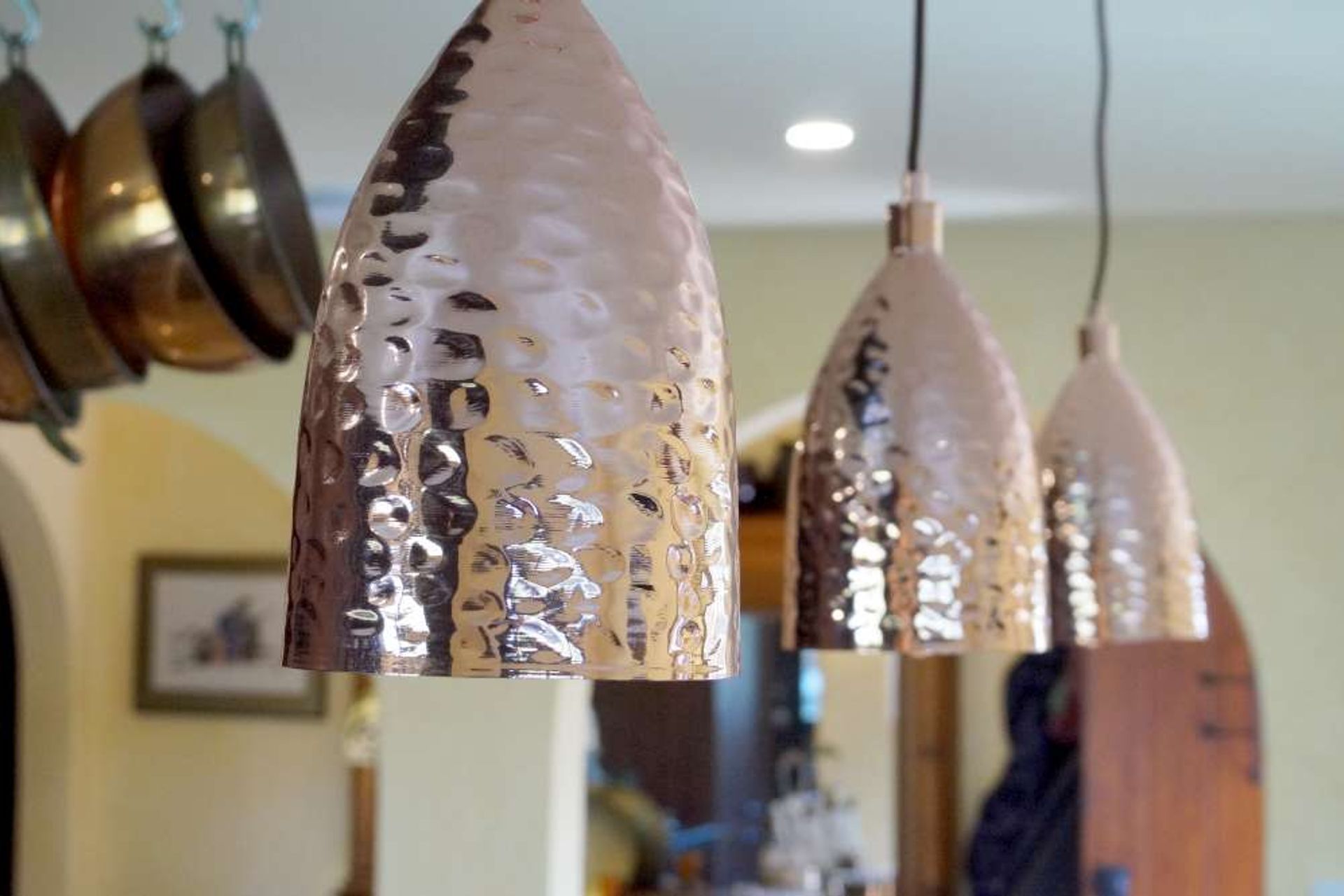 Rustic looking bronze hanging lights also added to the rustic feature of this kitchen in Orewa.