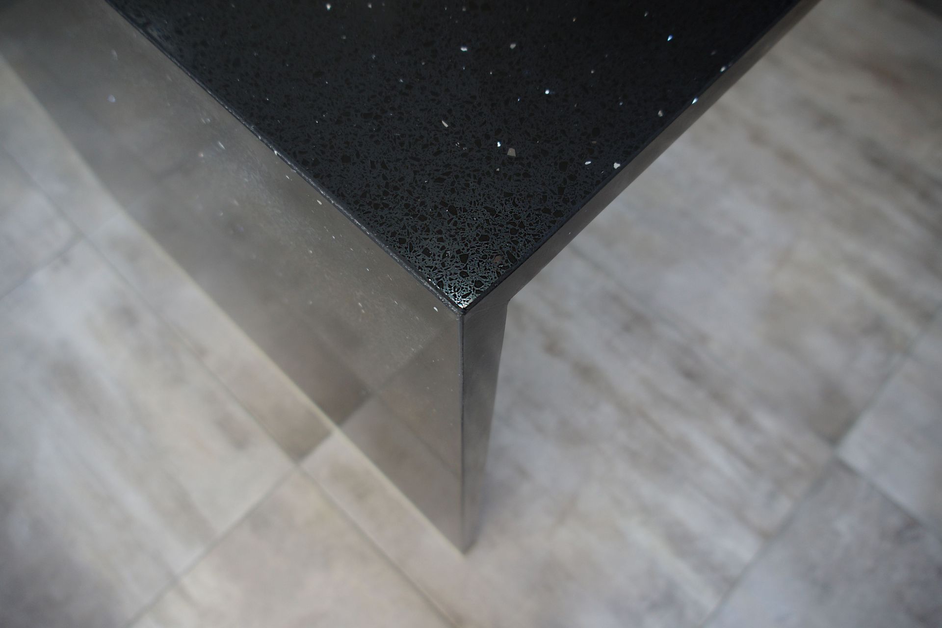 Kitchen renovation in Bucklands Beach: We engineered stone to look like black marble which was then infused  with shiny specs to add a touch of luxury for this kitchen renovation.