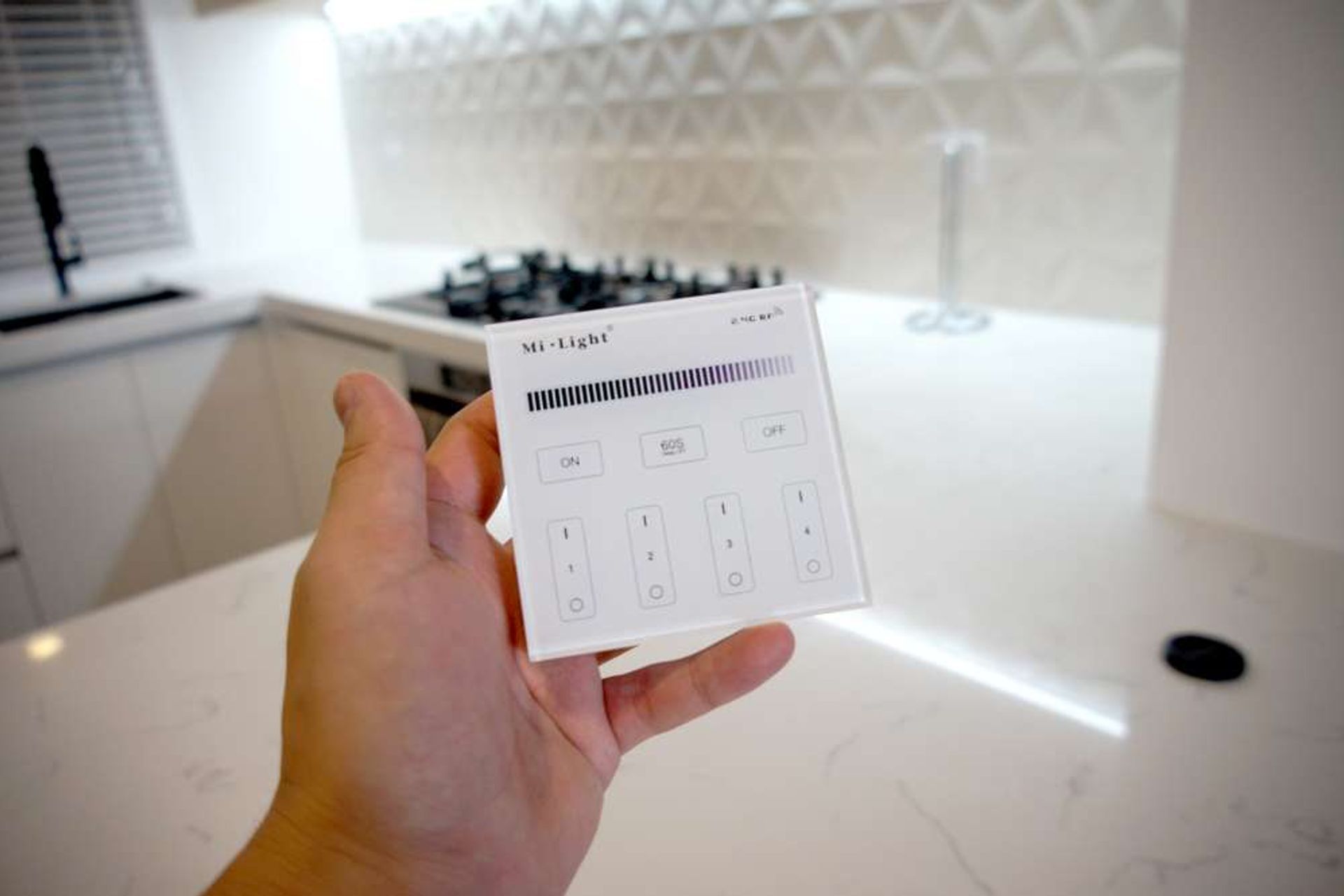 All LED lights in this kitchen can be made dimmer or brighter with this central remote