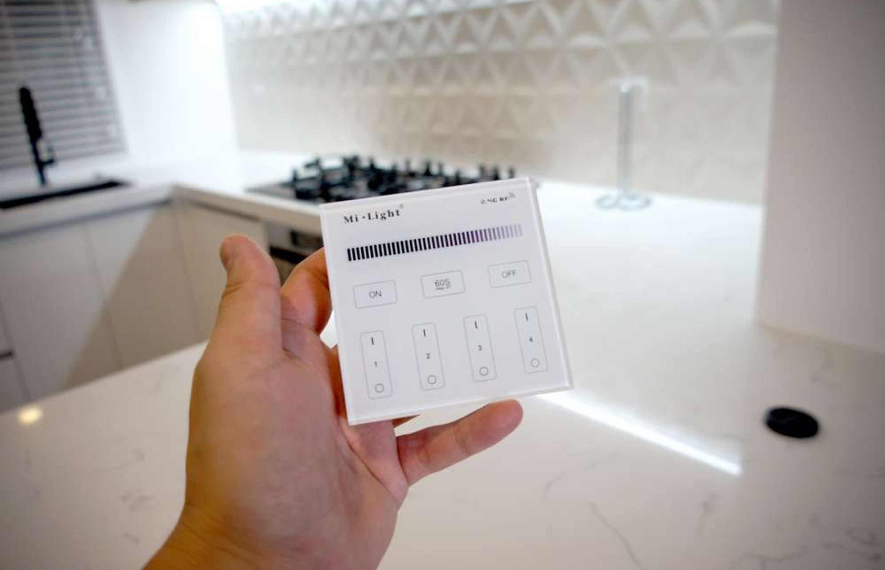 All LED lights in this kitchen can be made dimmer or brighter with this central remote
