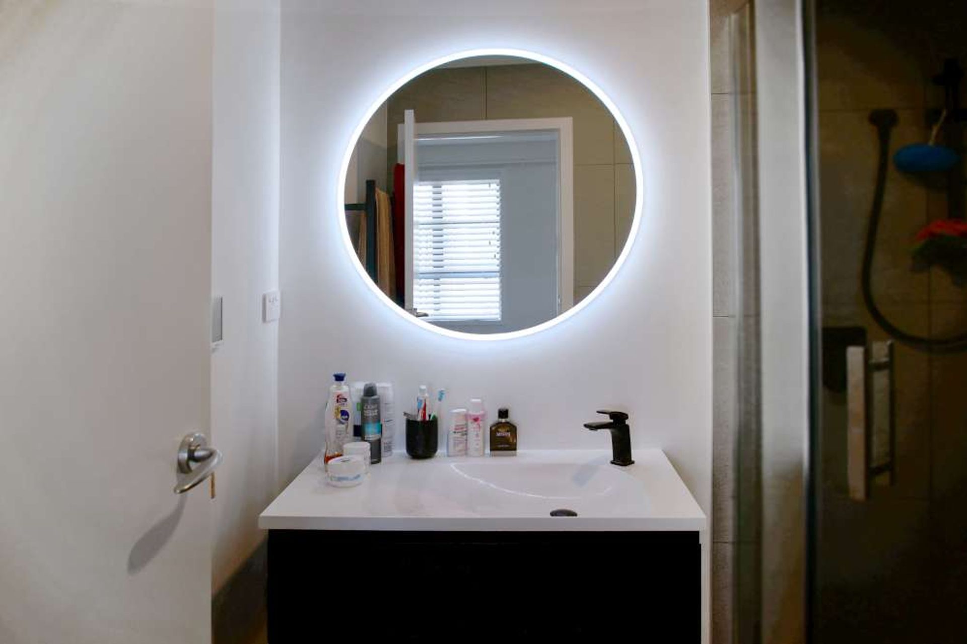 This bathroom renovation in Parnell was renovated to make it look luxurious and modern which was in line with our client’s urban lifestyle. The mirror installed had an LED anti-fog mirror with a touch button on it. The black floating shelves with sleek li