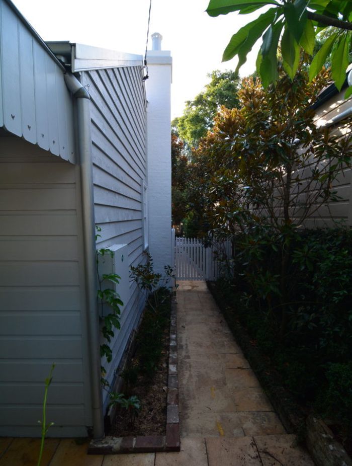 Re-using the original weatherboards after insulating the front section of the house greatly reduced the footprint of the total renovation.