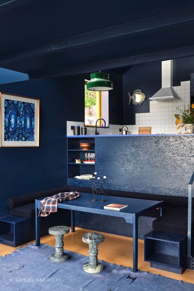 The booth seating in the dining nook was made by Fieldcraft and the table was a Trade Me find. “Everything’s the same colour, but we're using texture as the vehicle to move through the space,” says Natalie.