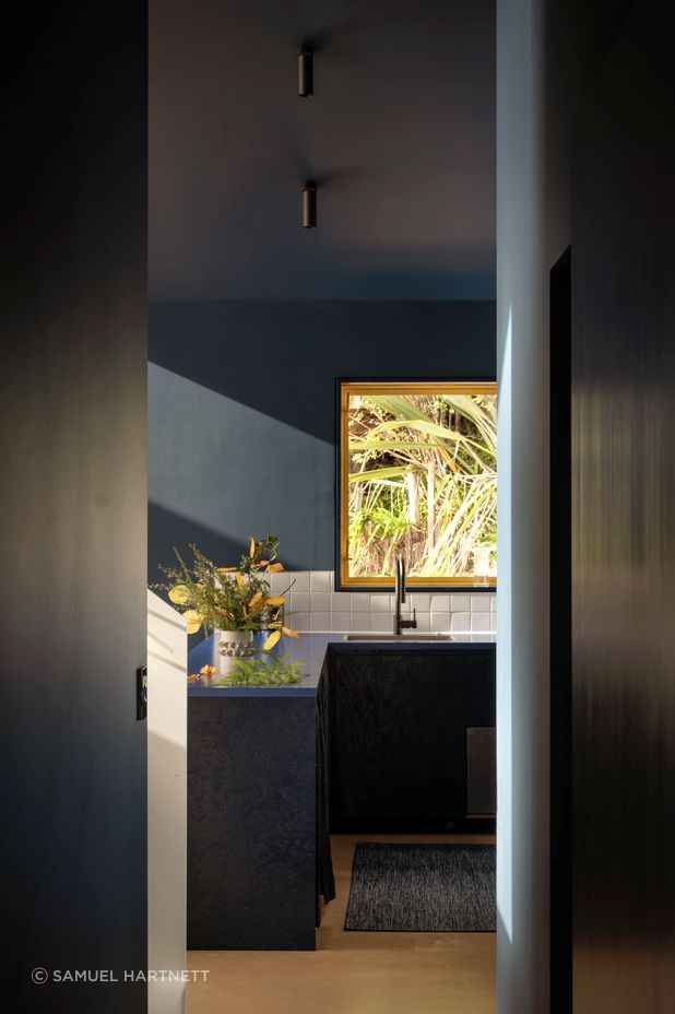 Formica finishes and curtained cupboards in the kitchen add to the bach feel. “When I create a space, I can see it in my head from the beginning, and I don't tend to deviate too much,” says Natalie.