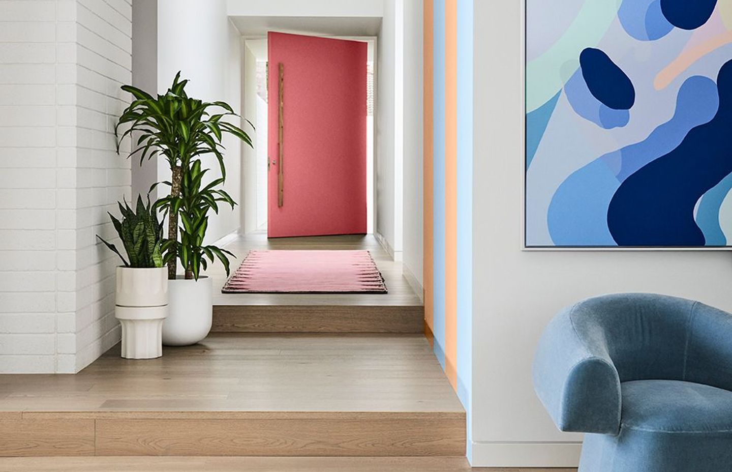 Image supplied by Dulux and features Dulux Ōkārito, stripes in Breezy Half & Herd Street, front door in Ashburton. Artwork: “At Play 2” by Callum Francis. Styling: Bree Leech, Photography: Lisa Cohen.