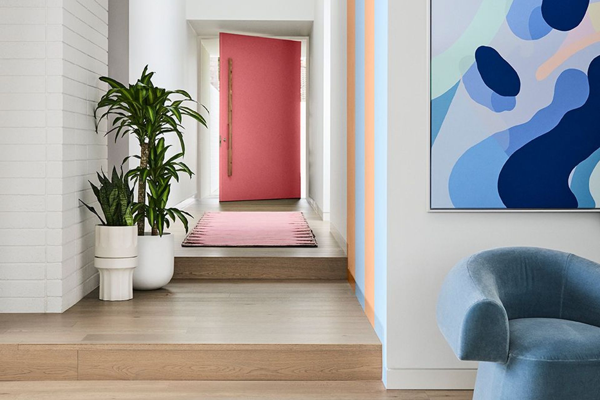 Image supplied by Dulux and features Dulux Ōkārito, stripes in Breezy Half & Herd Street, front door in Ashburton. Artwork: “At Play 2” by Callum Francis. Styling: Bree Leech, Photography: Lisa Cohen.