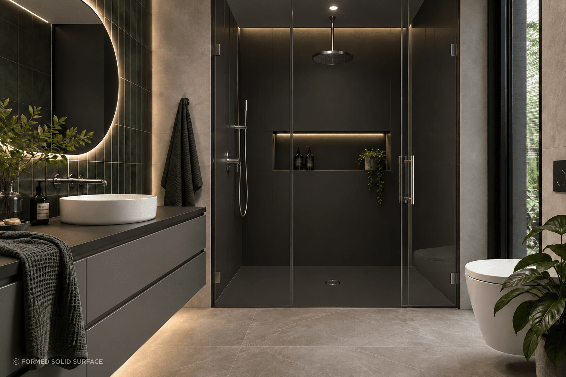 A considered approach to wet-area design, where custom solid surface shower bases, wall panels, niches and vanity surfaces create a cohesive architectural finish.
