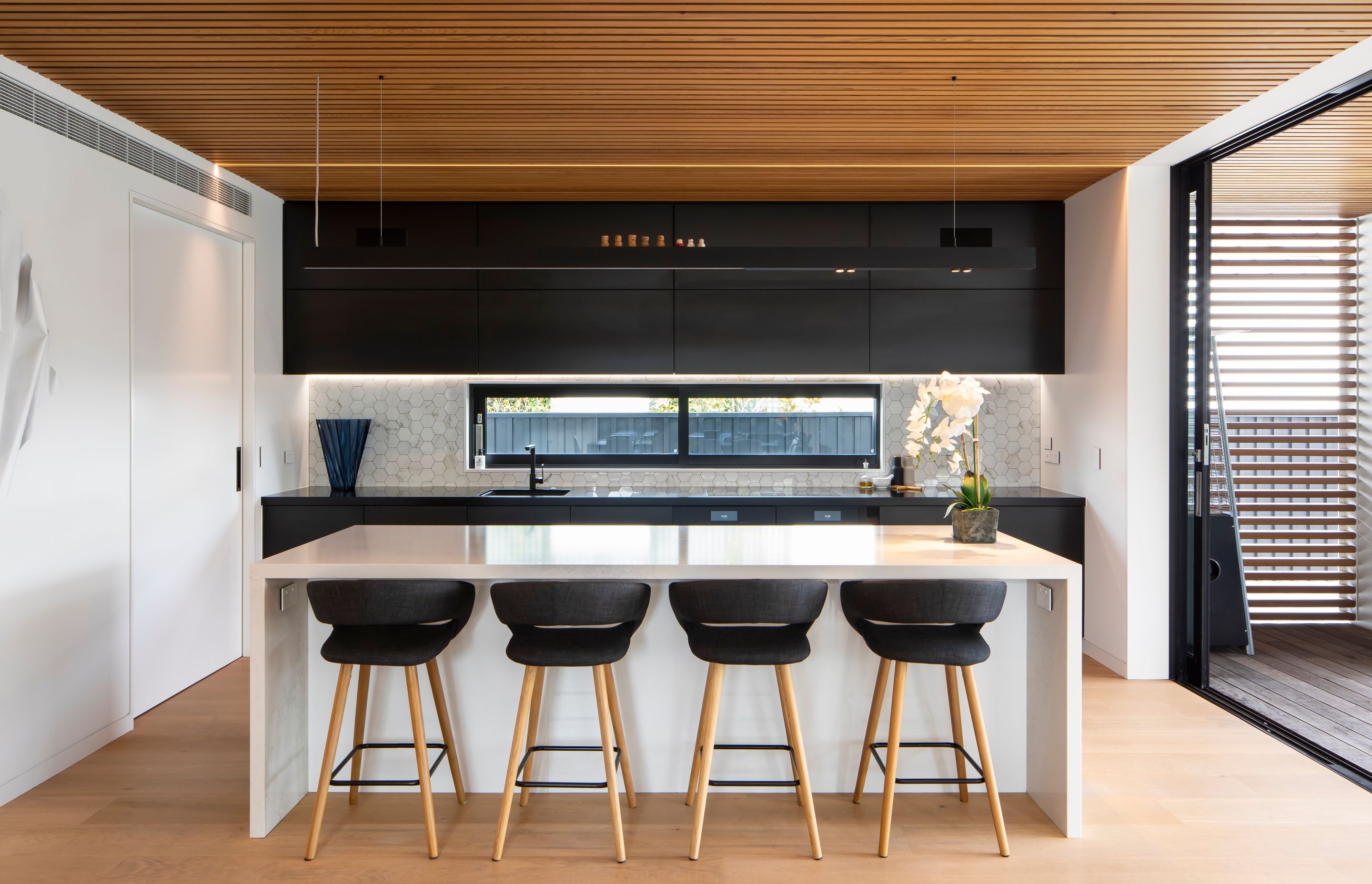 The hexagonal marble tiles in the kitchen are just one example of this home's beautiful details - Photography: Sarah Rowlands