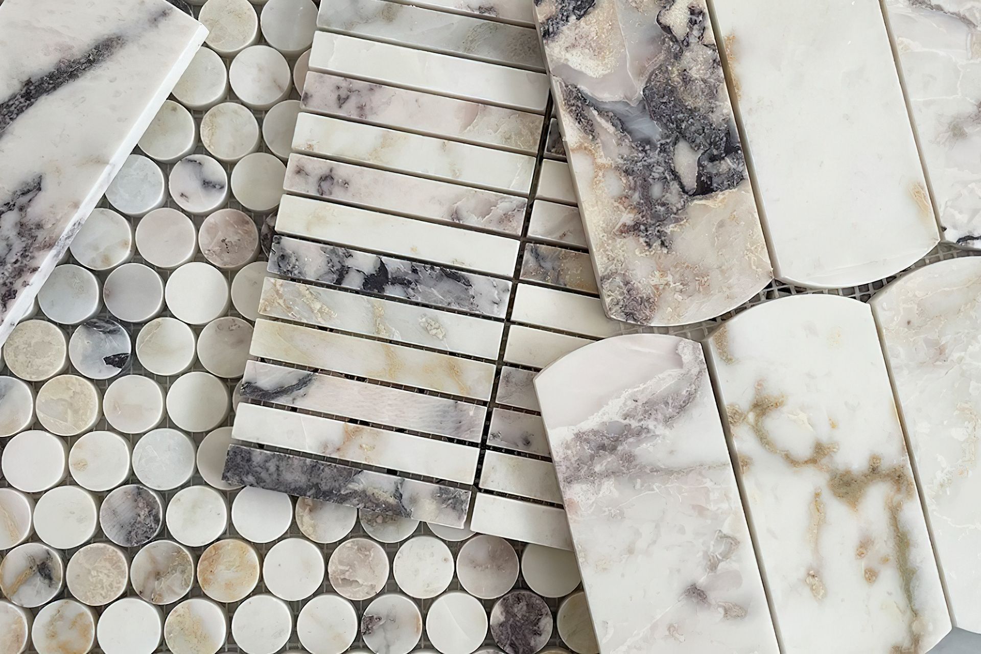 Mosaic tiles are available in a wide variety of tile shapes from stylish Kit Kat tiles, pennyrounds and plenty more. These small format tiles arrive to you already arranged in their pattern with each individual tile attached to a mesh backing sheet. This makes the tiles easier to lay while keeping their pattern in order. Pictured: Our luxurious natural marble, Dorado Stone collection.