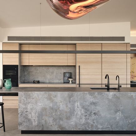 A sophisticated, streamlined kitchen with sweeping views