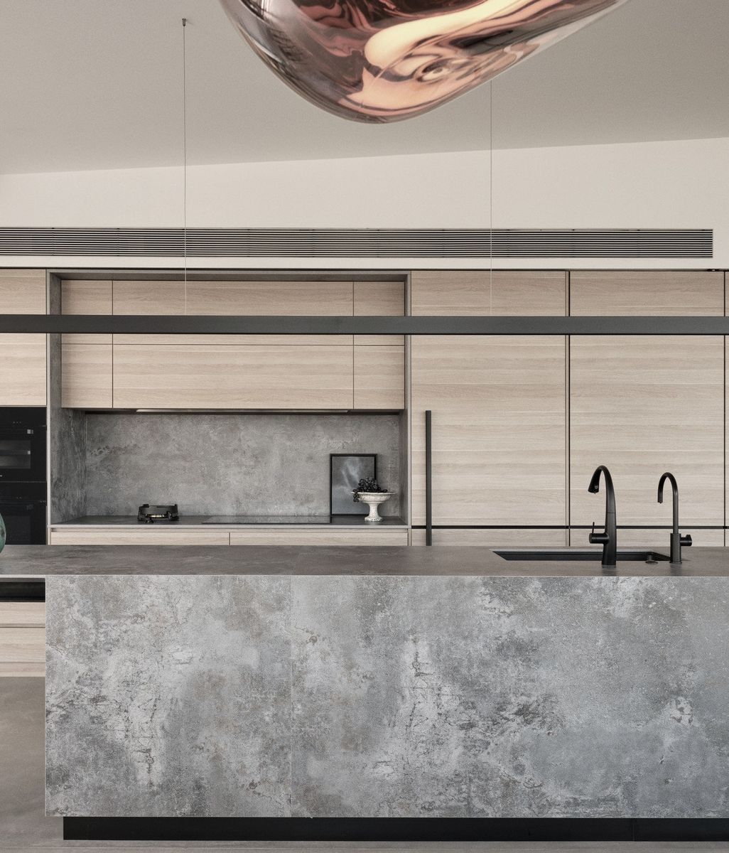 A sophisticated, streamlined kitchen with sweeping views