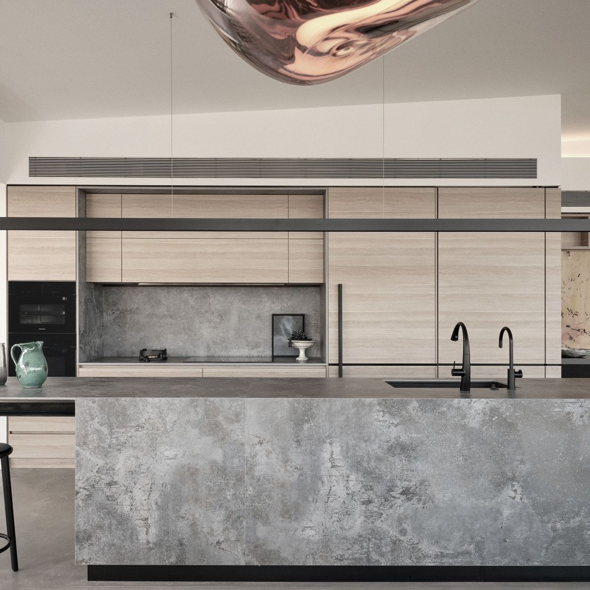 A sophisticated, streamlined kitchen with sweeping views