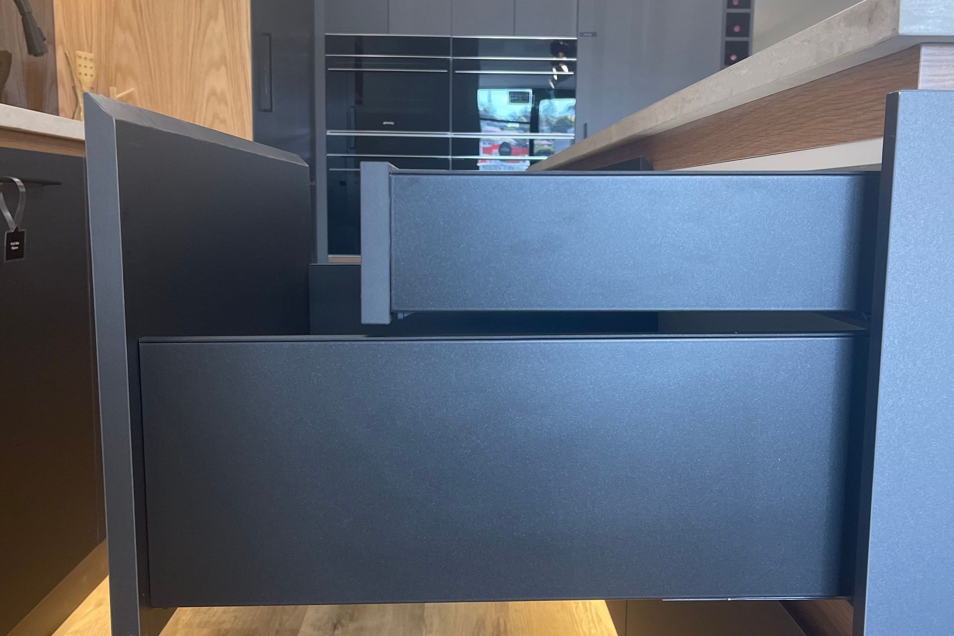 Smaller hidden drawers within the larger drawers to create an even and seamless look from the exterior.