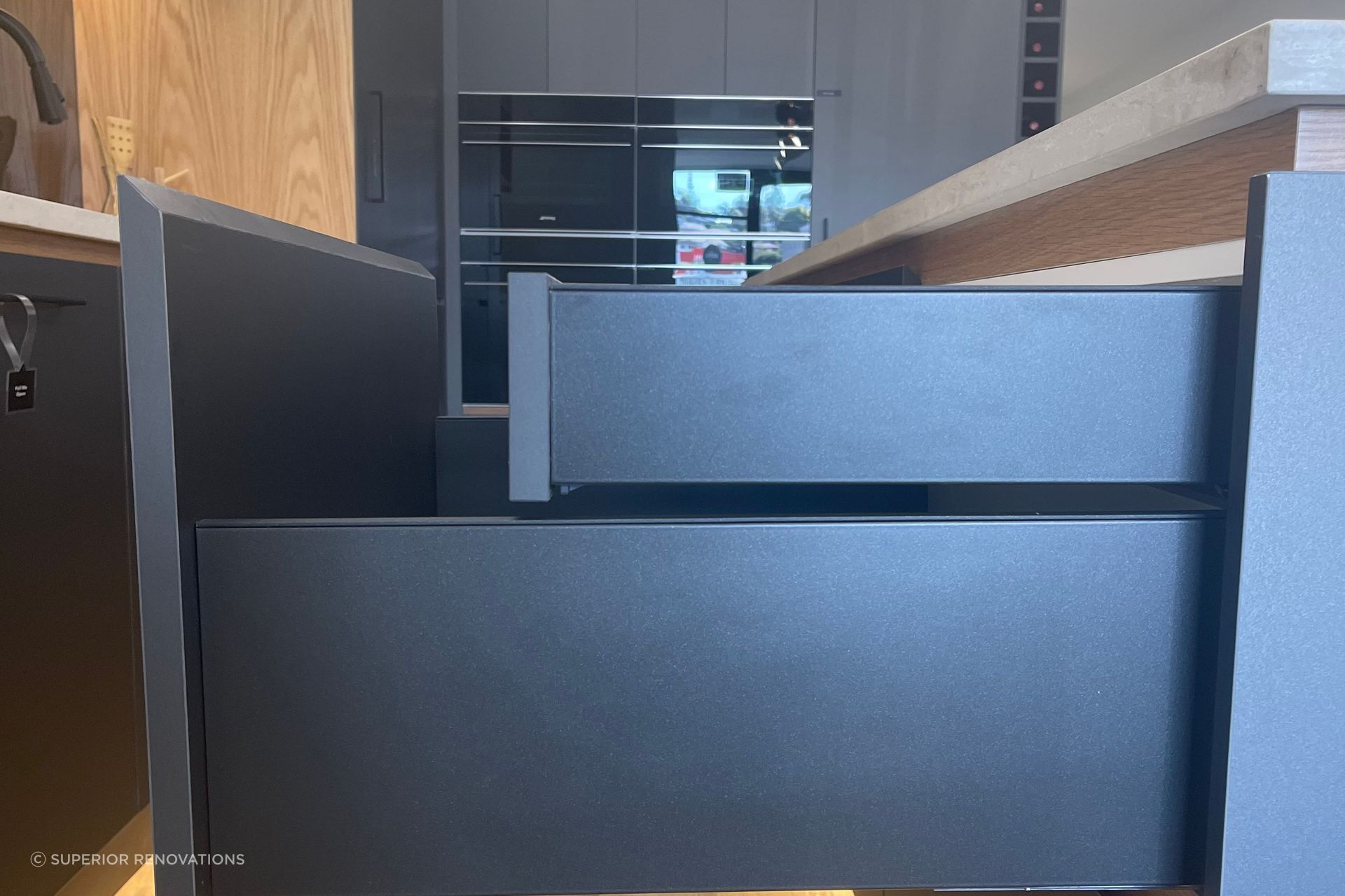 Smaller hidden drawers within the larger drawers to create an even and seamless look from the exterior.