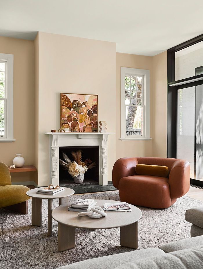 STYLING: BREE LEECH. PHOTOGRAPHER: LISA COHEN. COLOURS: FIREPLACE WALL: KAURI CLIFFS / WALLS EITHER SIDE OF FIREPLACE: KUAOTUNU. "THE MAGIC SANDHILL" ARTWORK BY MEL OBST.