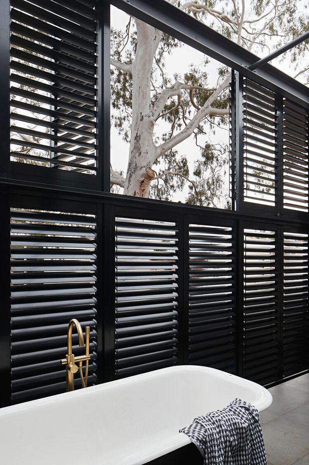 All about the tree: this renovation to an old general store in South Melbourne respects the existing tree and the history of the building. Yes, that is an external bathtub that you are looking at on the upper storey! This was a unique idea of the clients who dreamed of a relaxing bath while staring up at the canopy and stars.