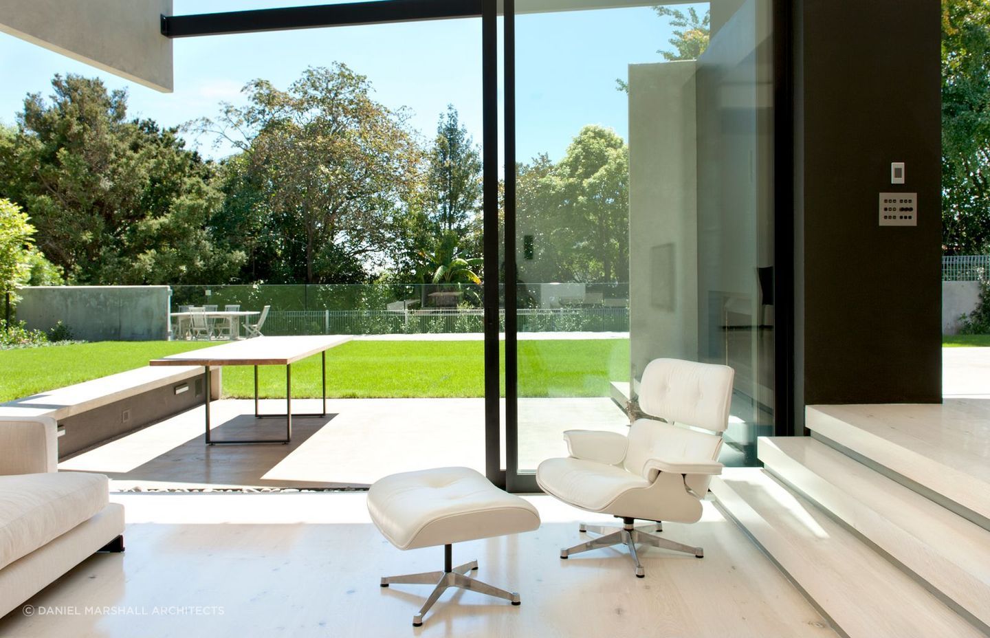 The concrete clad exterior is matched inside with concrete flooring - Photography: Emily Andrews &amp; Ernie Shackles