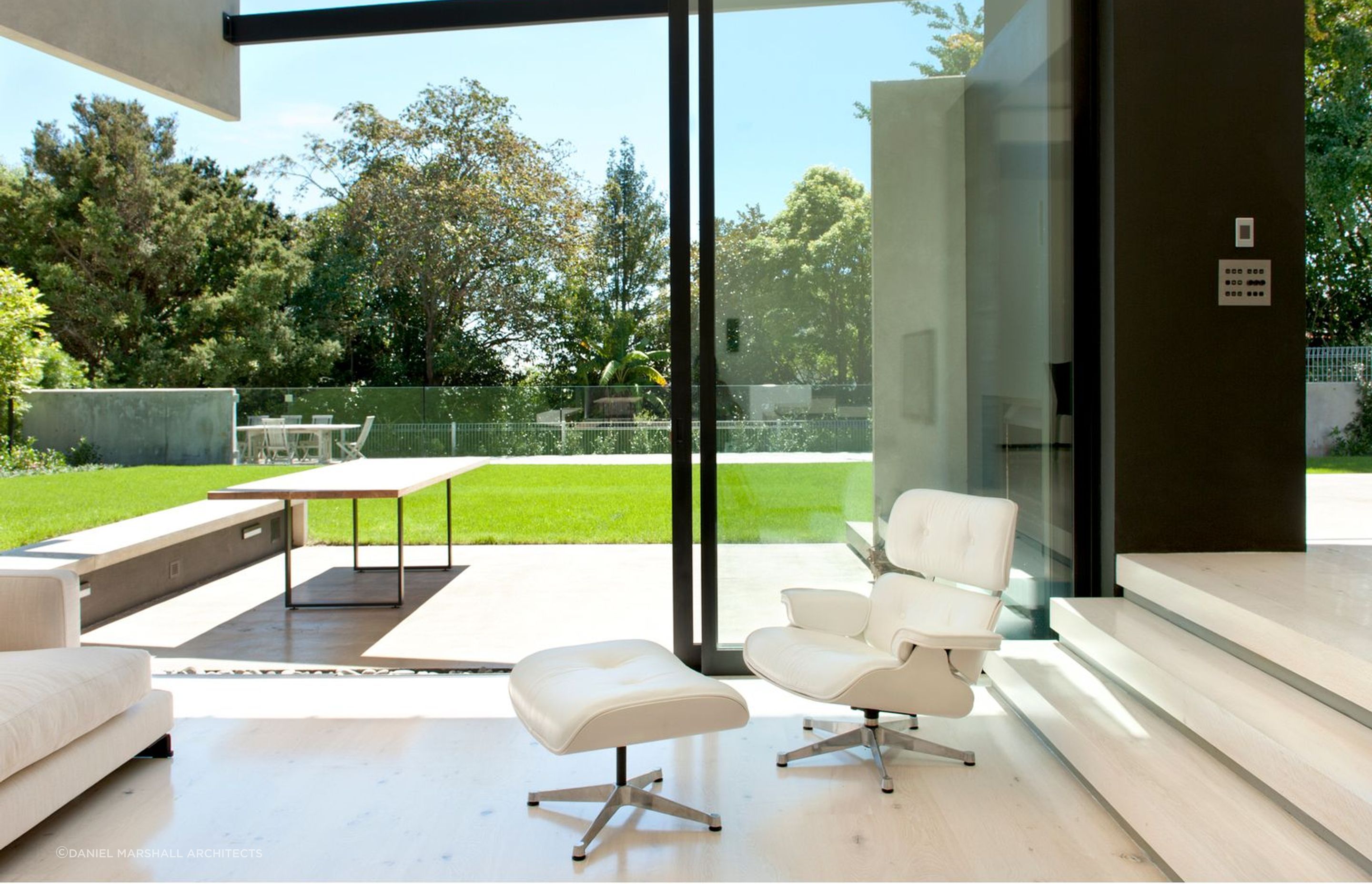 The concrete clad exterior is matched inside with concrete flooring - Photography: Emily Andrews &amp; Ernie Shackles